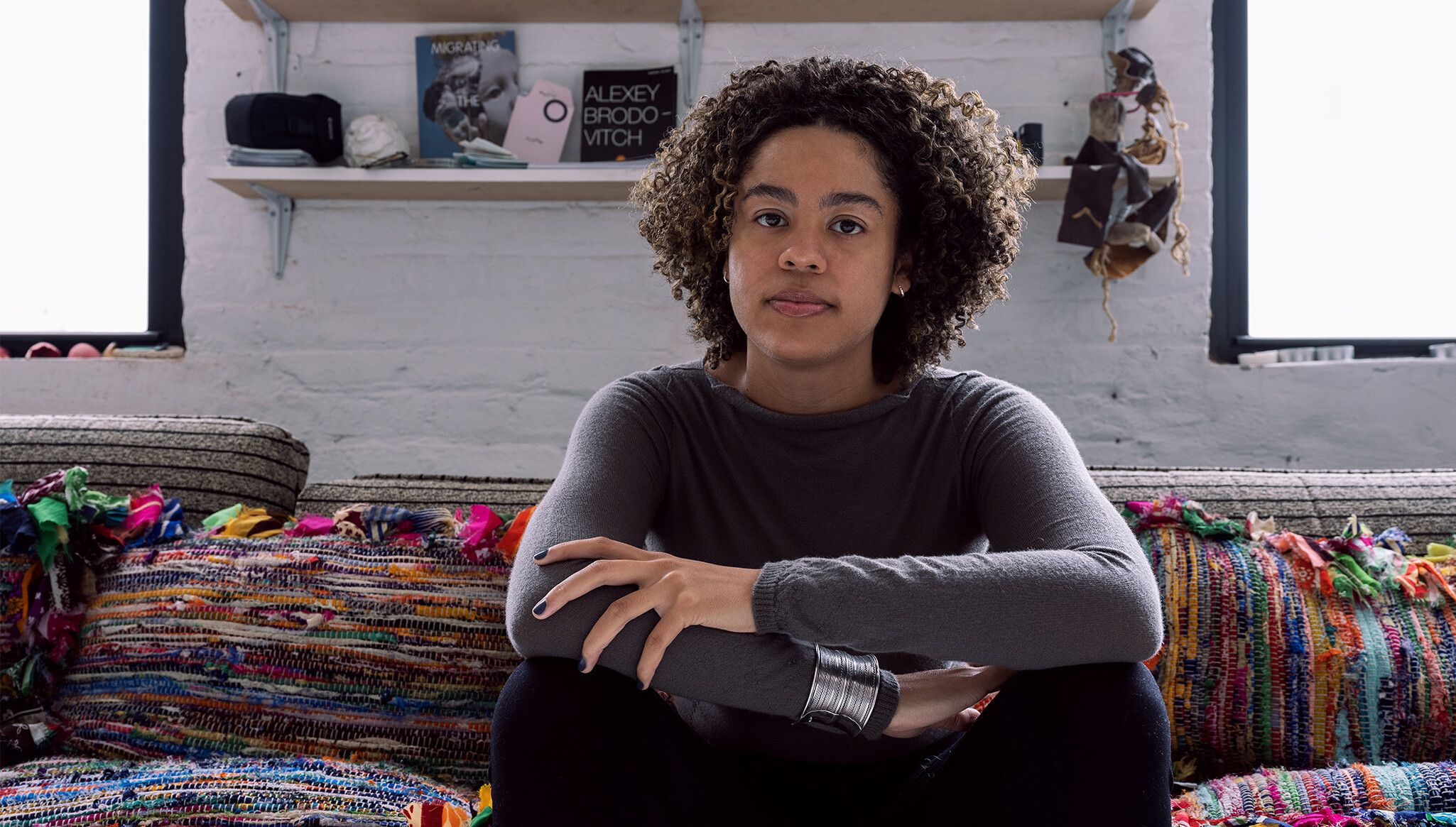 A photo of Tau Lewis in her studio, dated 2022.