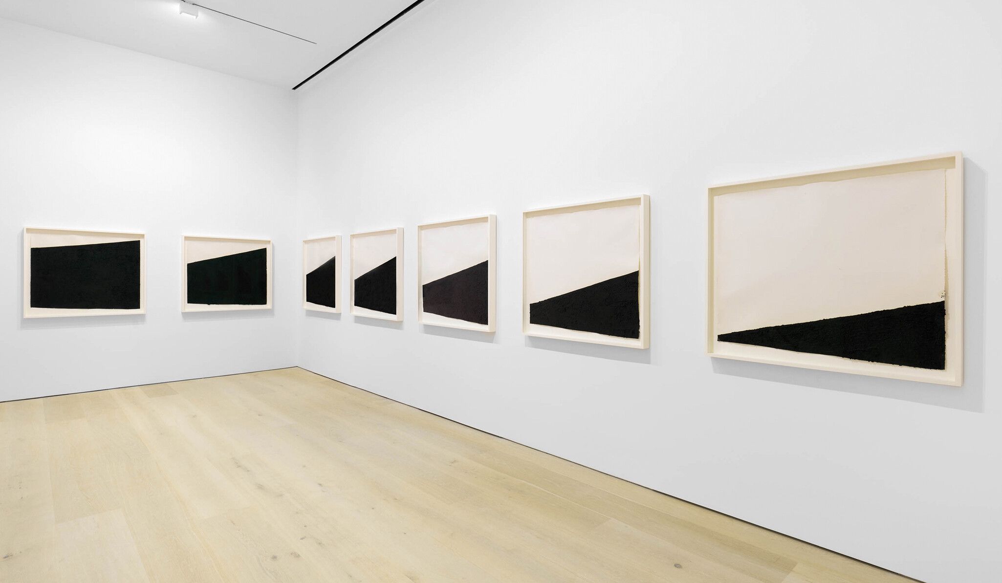 A paintstick, etching ink, and silica on handmade paper in seven (7) parts by Richard Serra, titled Drawing in 7 Parts, dated 2021.