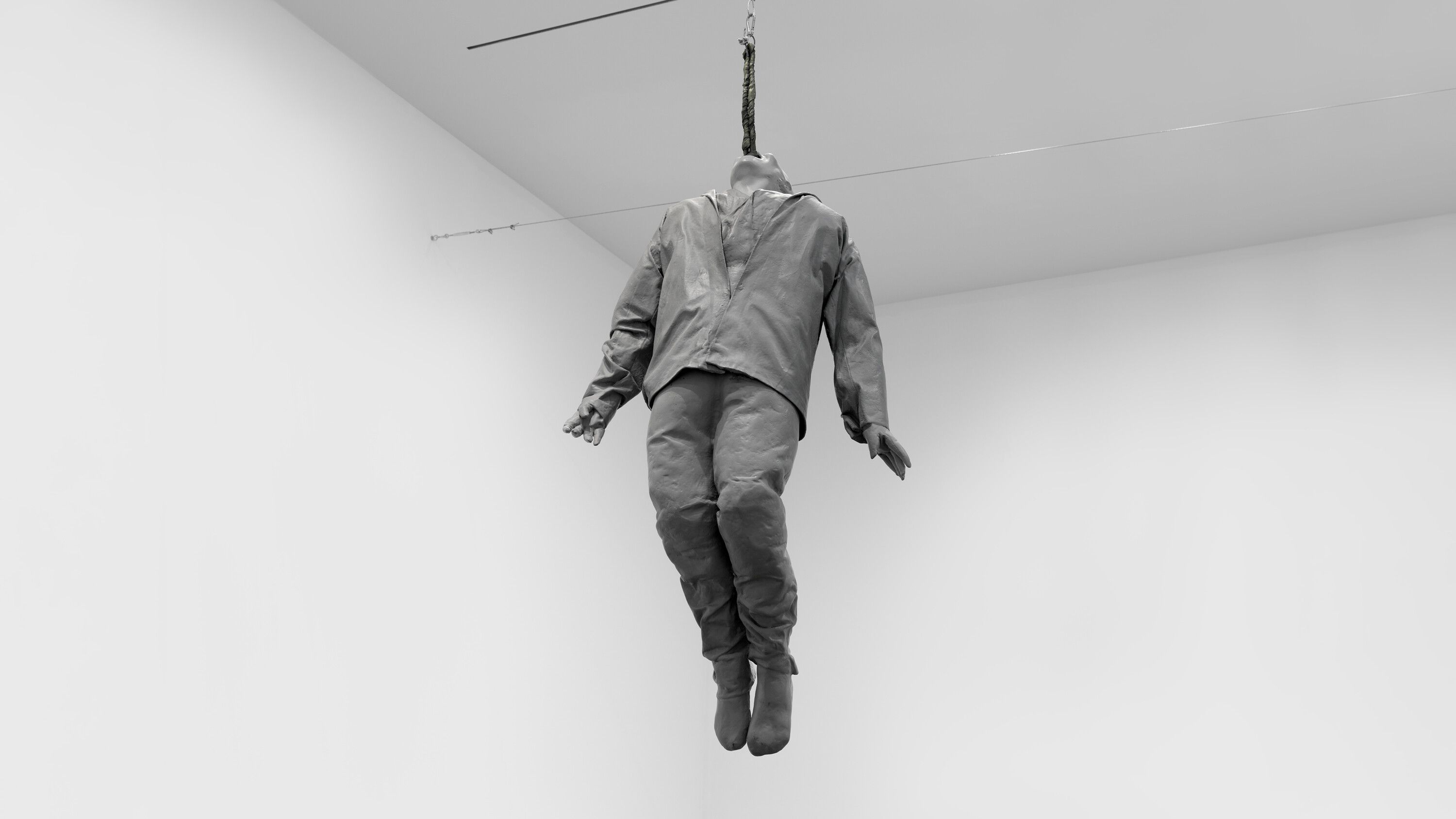 A suspended sculpture by Juan Muñoz, titled Hanging Figure, dated 1997.