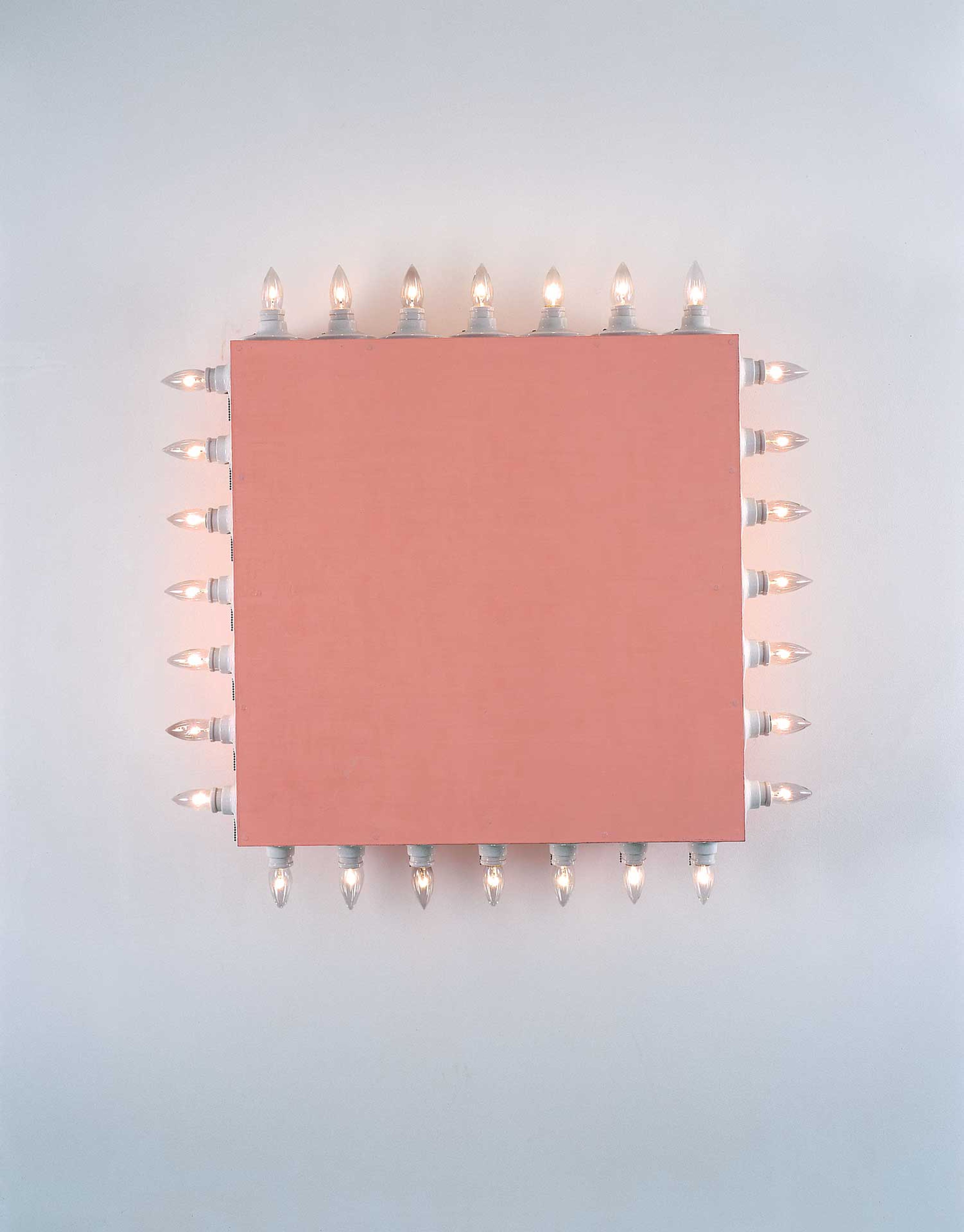 A mixed media wall-mounted sculpture by Dan Flavin, titled icon V (Coran's Broadway Flesh), dated 1962.