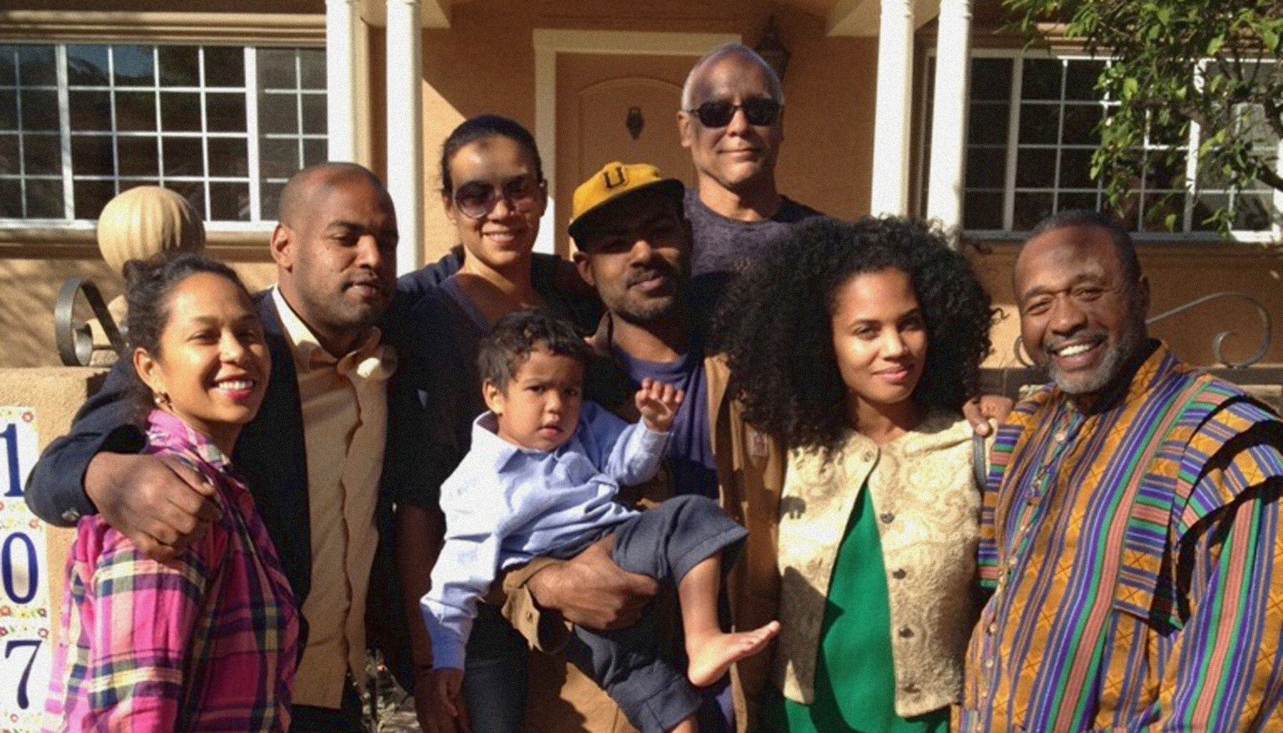 A photo of Noah, Karon, and Moses Davis with family and friends in Los Angeles.