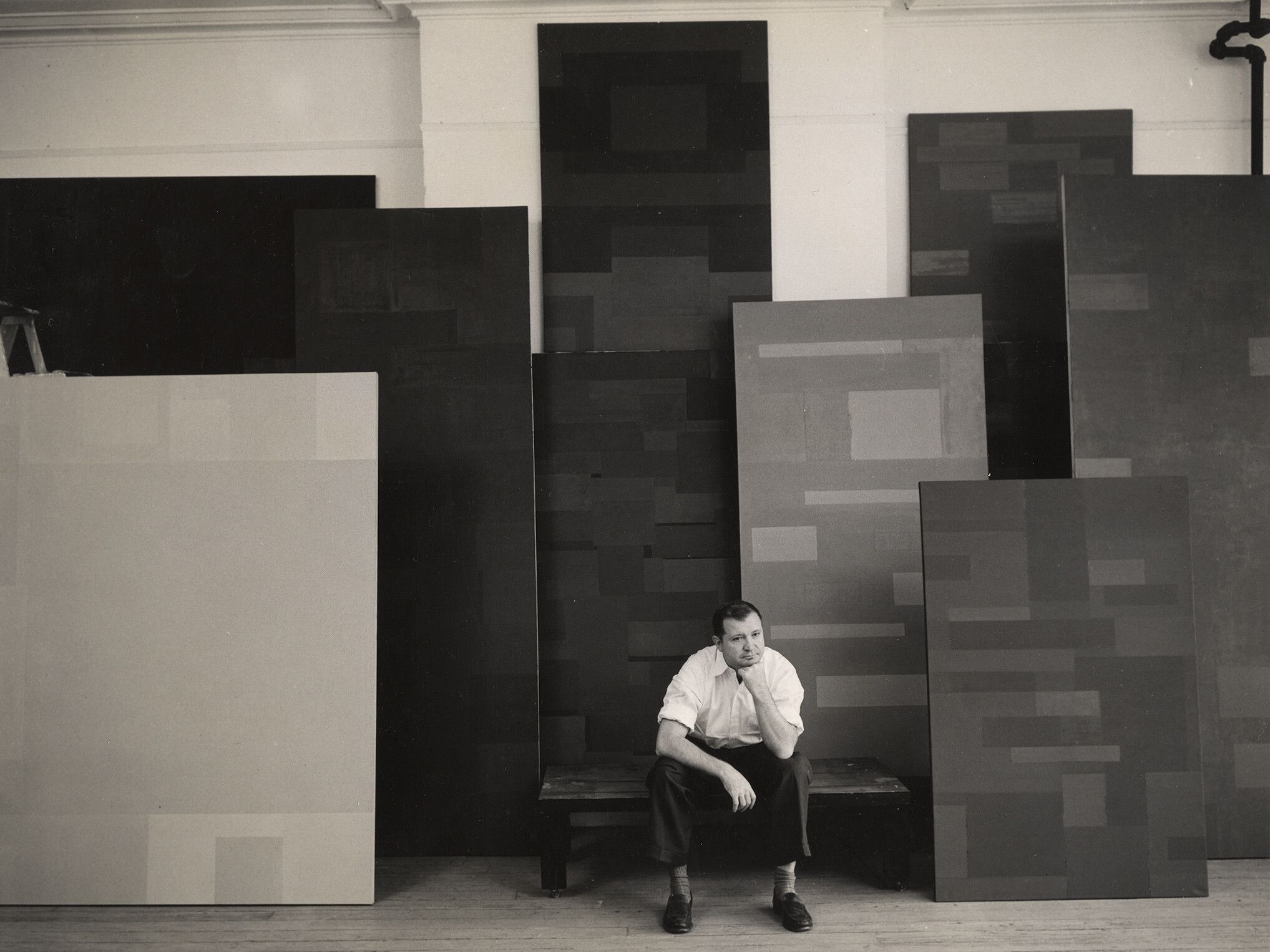 A photo of Ad Reinhardt in his studio in 1953. Photo by Walter Rosenblum.