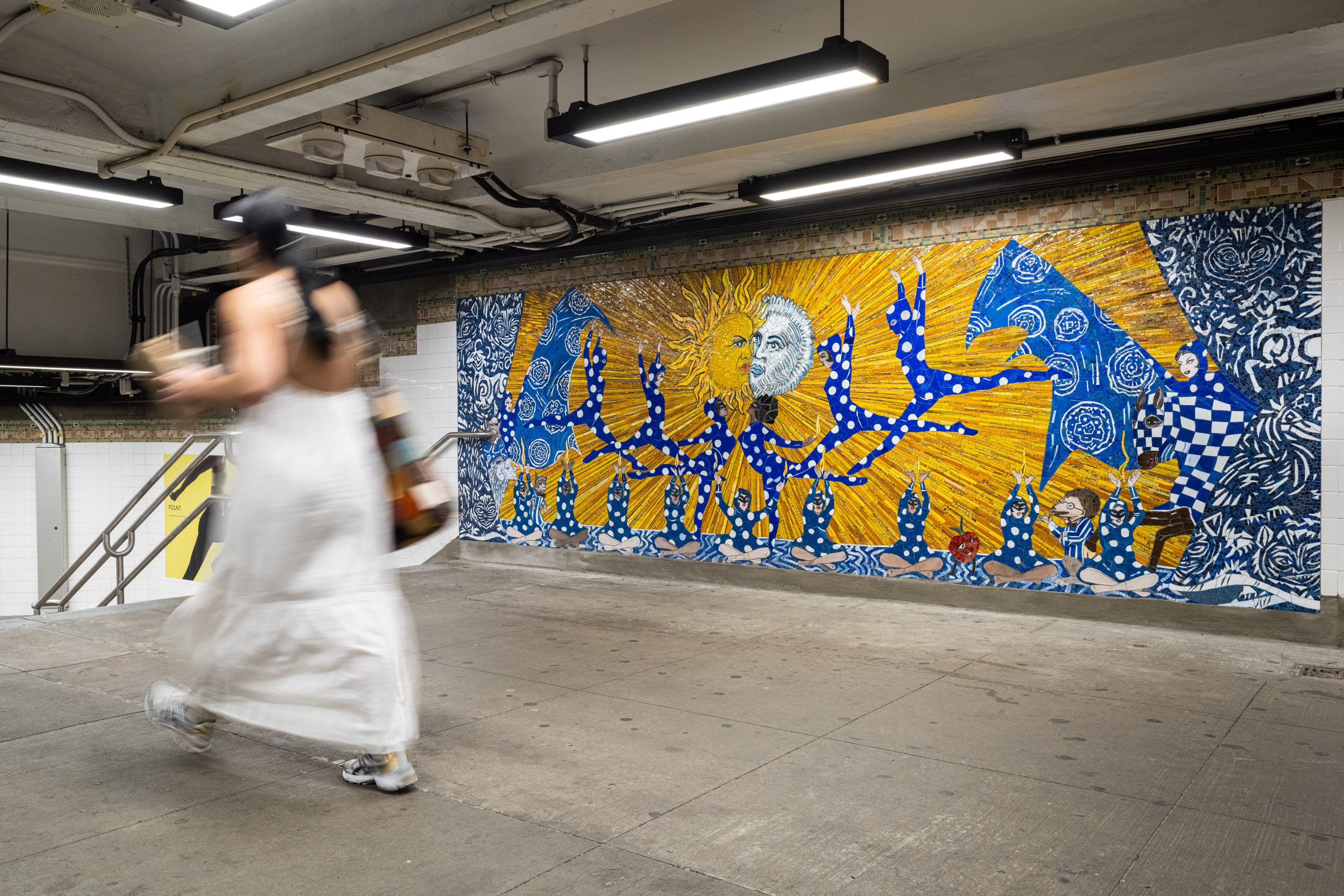 Woman working across a mosaic commissioned by the MTA called No Less Than Everything Comes Together, Marcel Dzama, 2021.