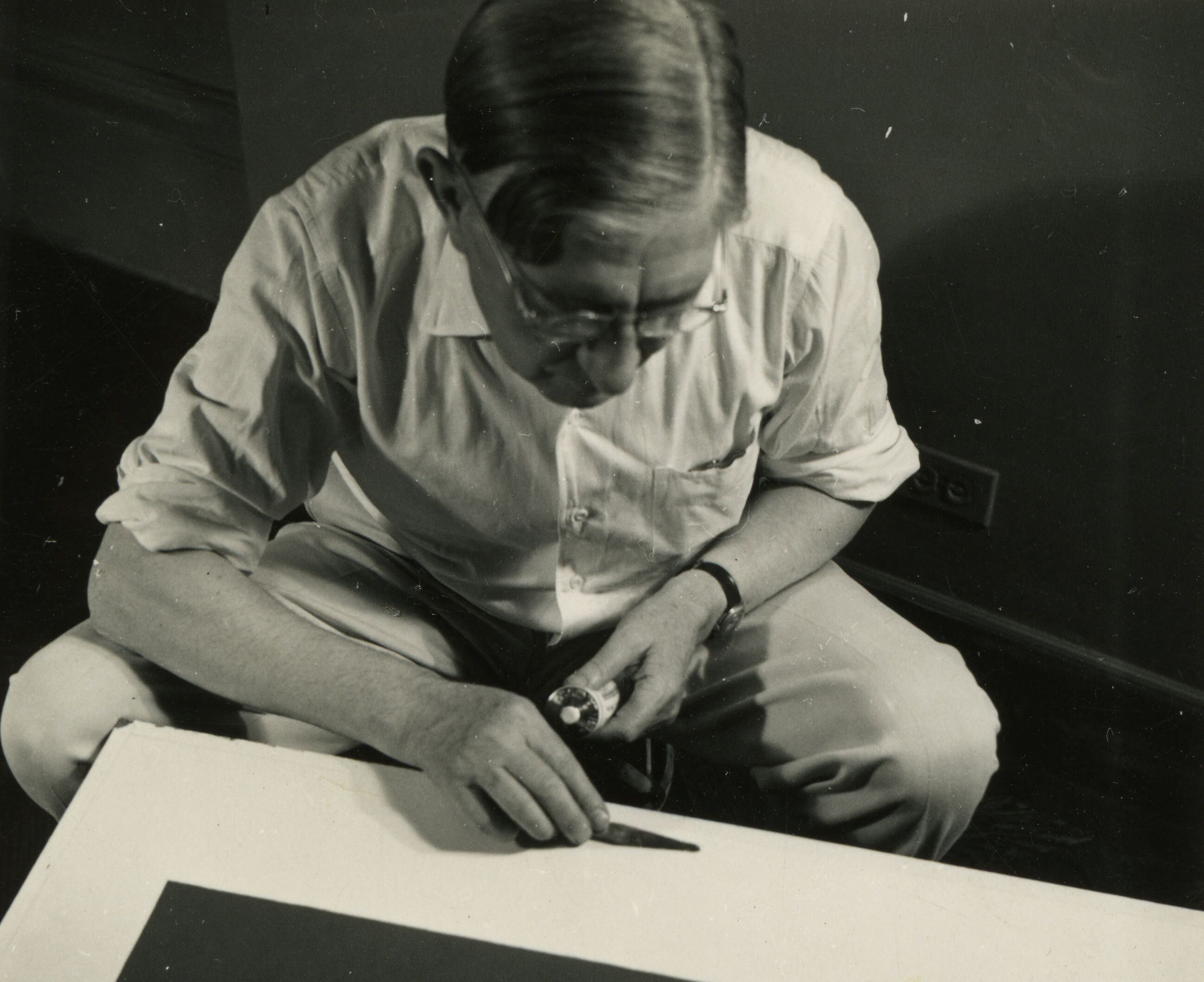 A photo of Josef Albers with Homage to the Square works, not dated