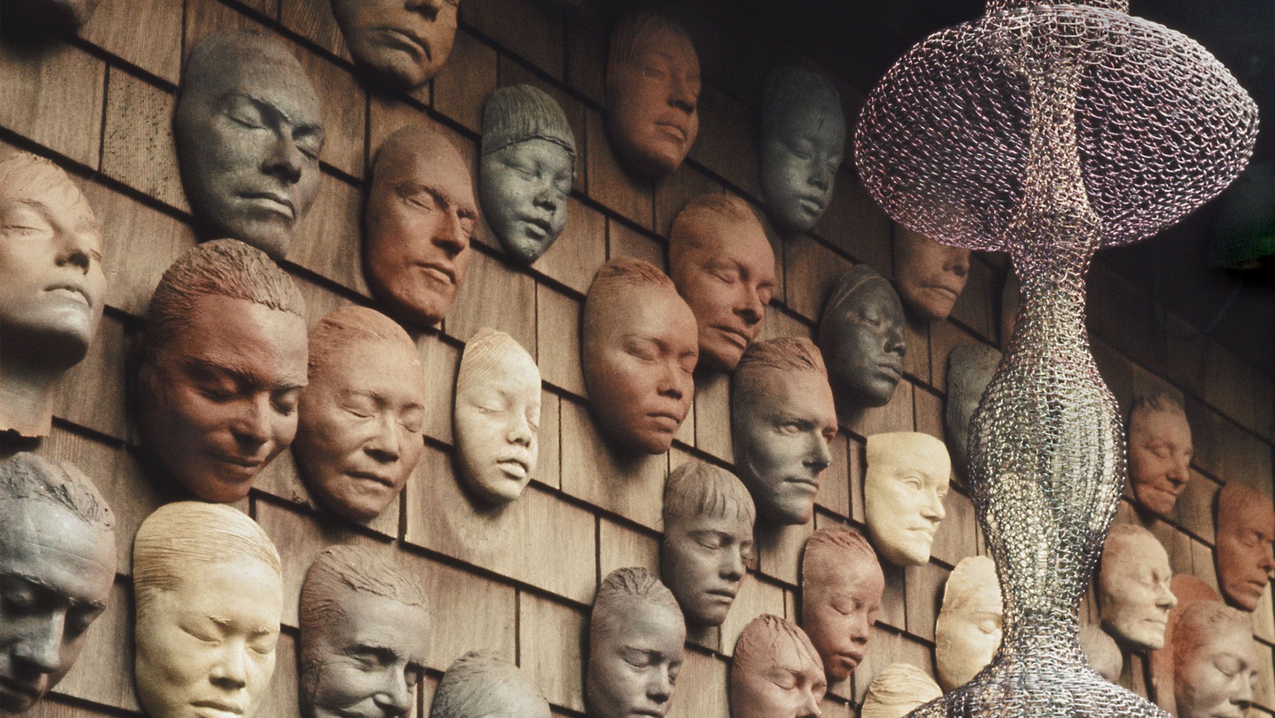 Ruth Asawa, Untitled (LC.012, Wall of Masks), c. 1966–2000 (detail), and Untitled (S.540), 1950s. Photo by Laurence Cuneo.