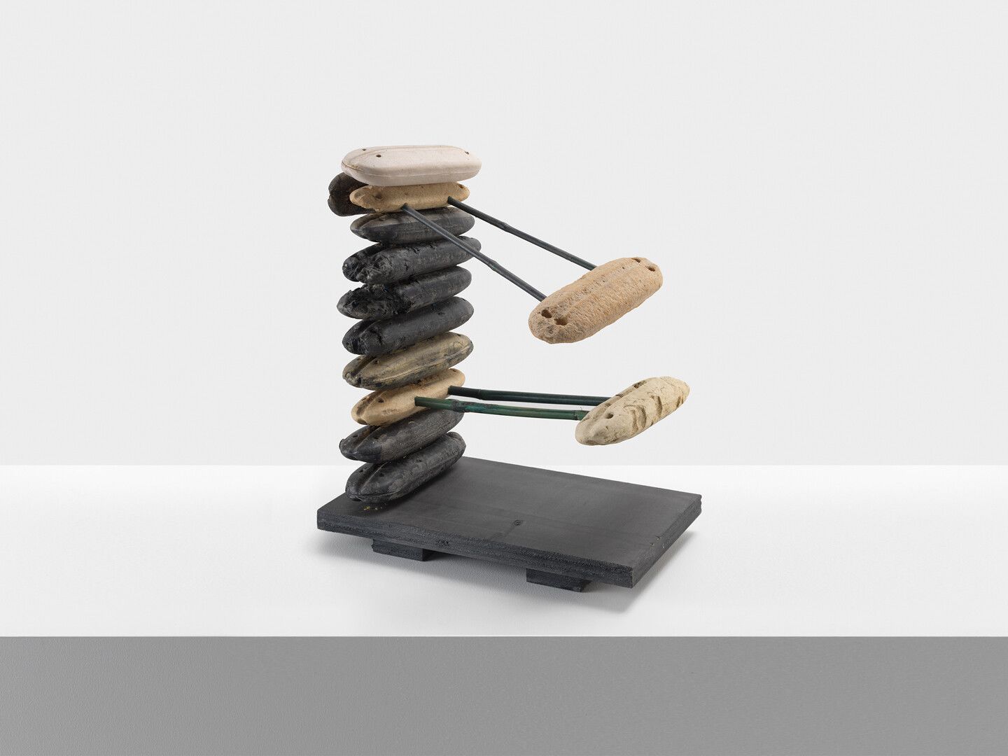 A foamed plastic fishing net floats, ink, acrylic mica mortar and bamboo garden stakes on wood base with paint primer and wax sculpture by Al Taylor, titled, waxed, dated 1998.