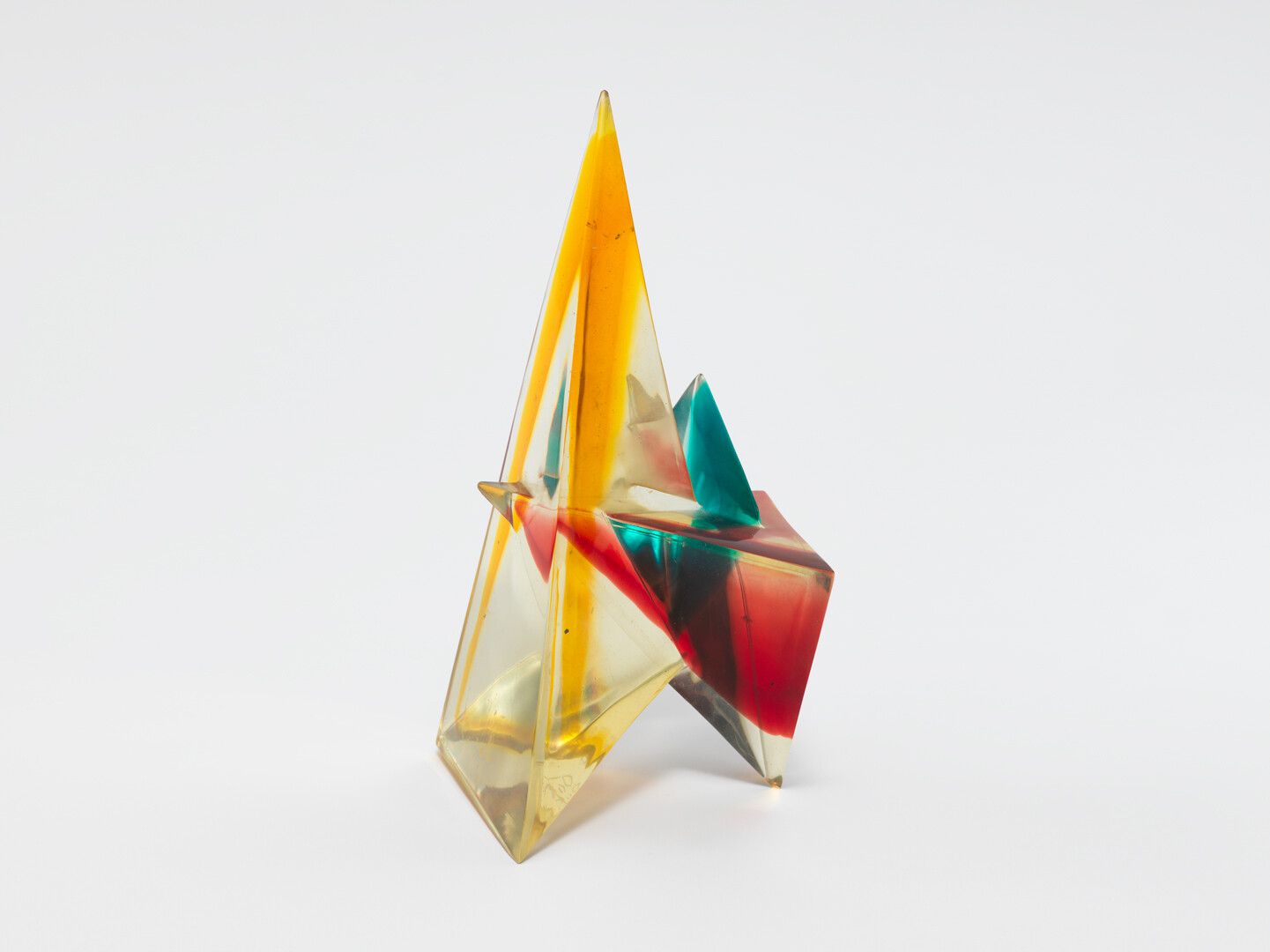 A polyester resin sculpture by Leo Amino, titled, Refractional #187, dated 1983. 