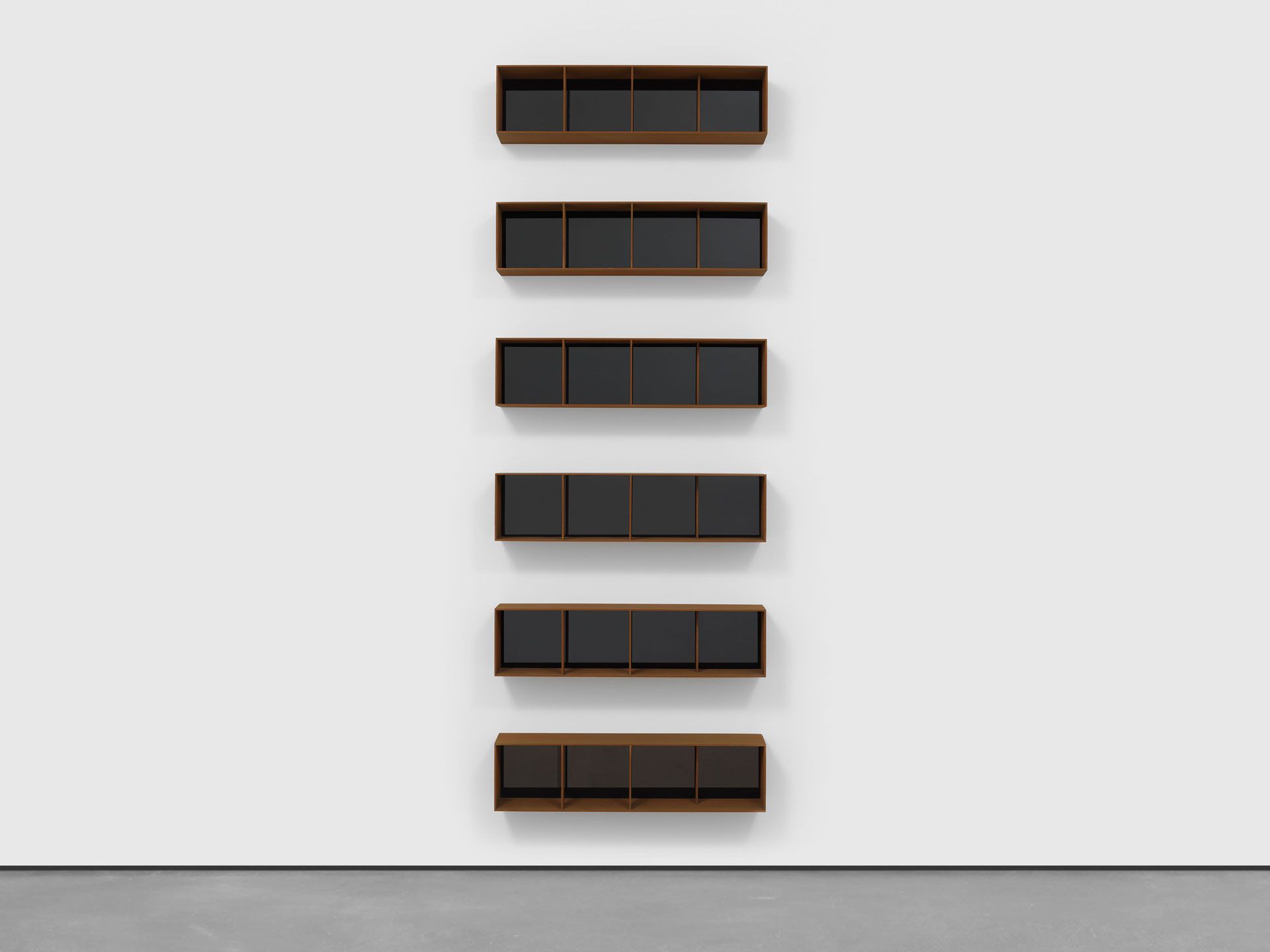 An untitled Cor-ten steel and black acrylic sheets sculpture by Donald Judd, dated 1994.