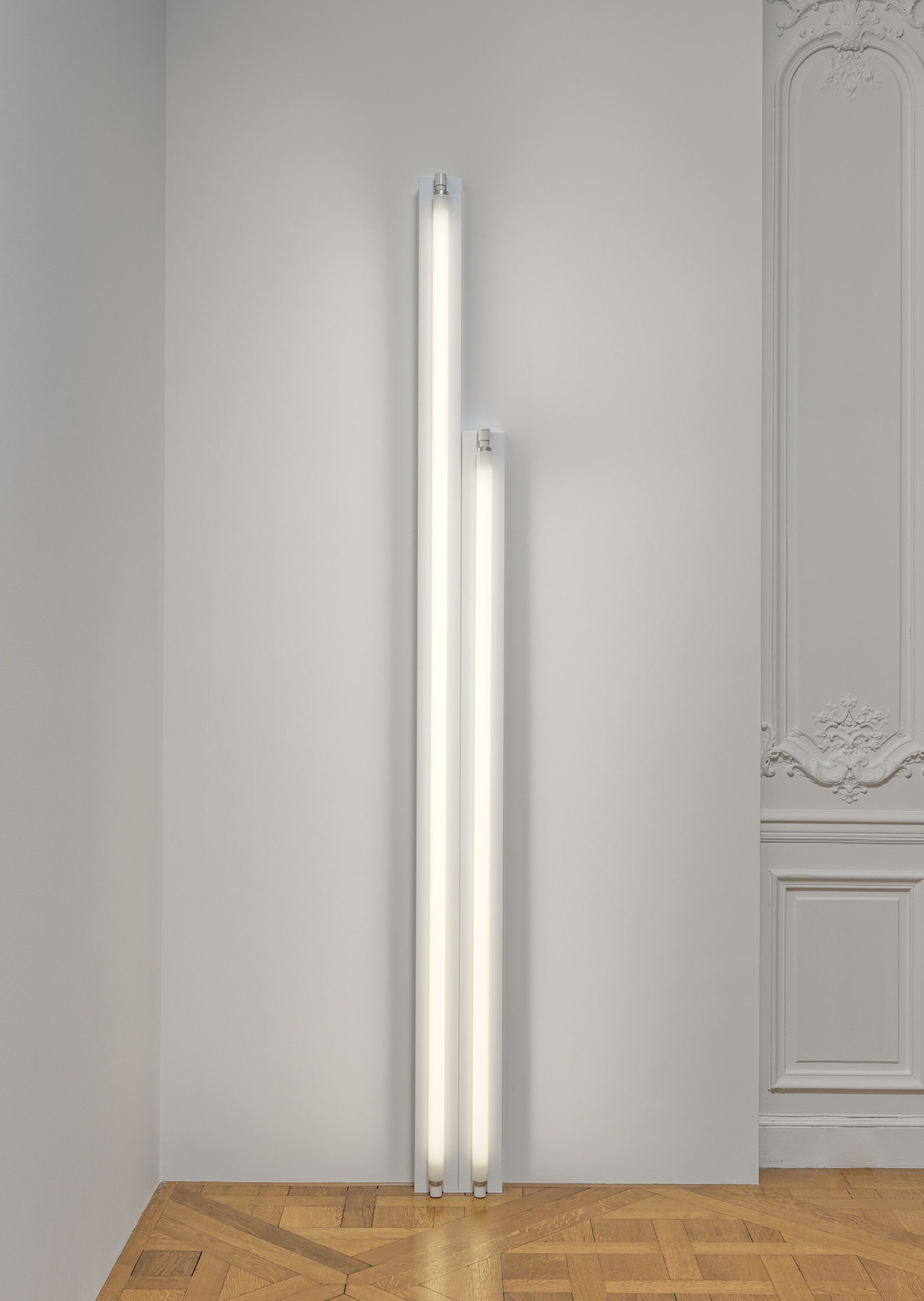 A cool white fluorescent light sculpture by Dan Flavin, called untitled, dated 1967.