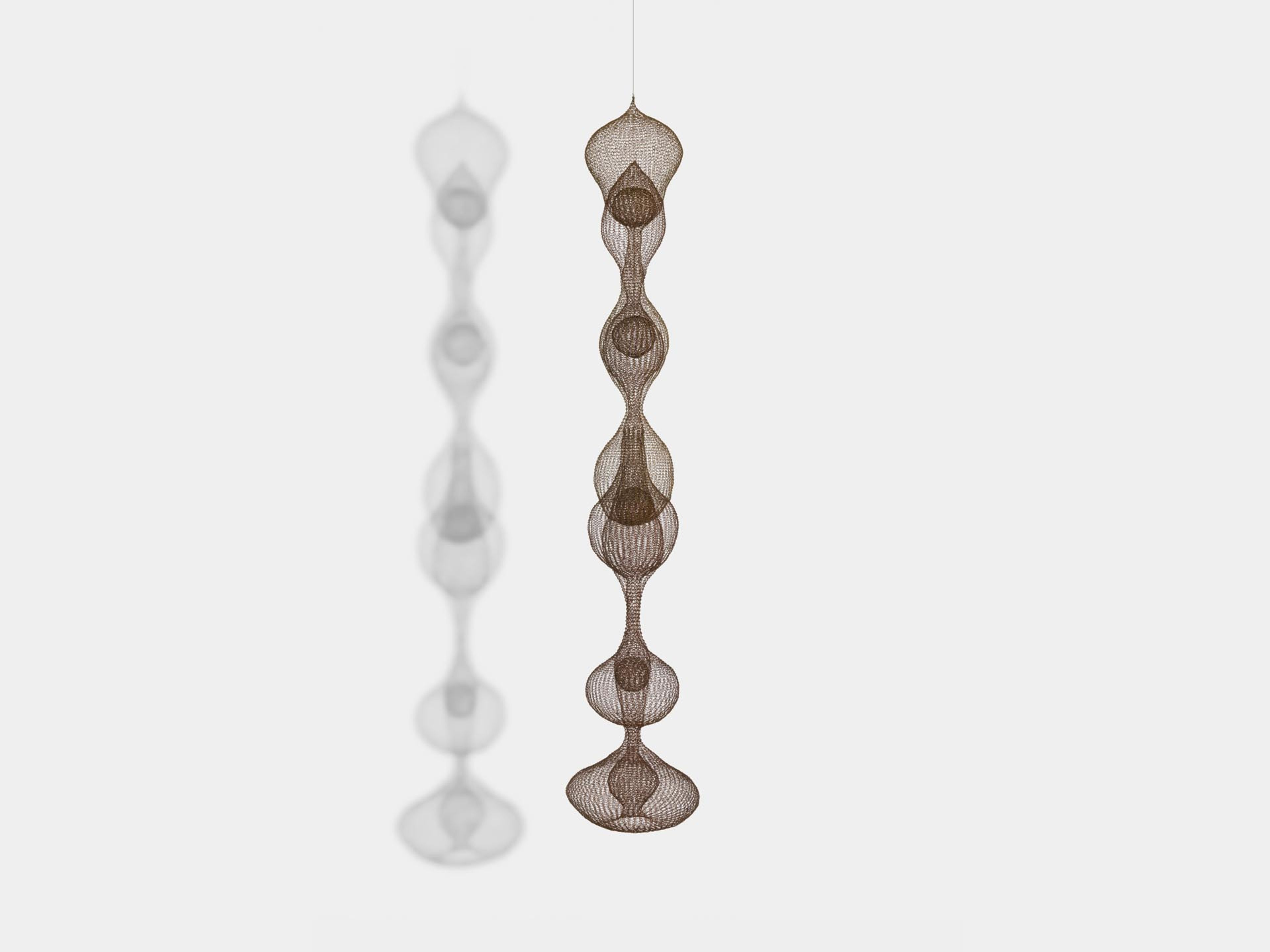 A sculpture by Ruth Asawa, titled Untitled (S.065, Hanging Seven-Lobed, Multi-Layer Continuous Form within a Form), dated circa 1960 to 1963.