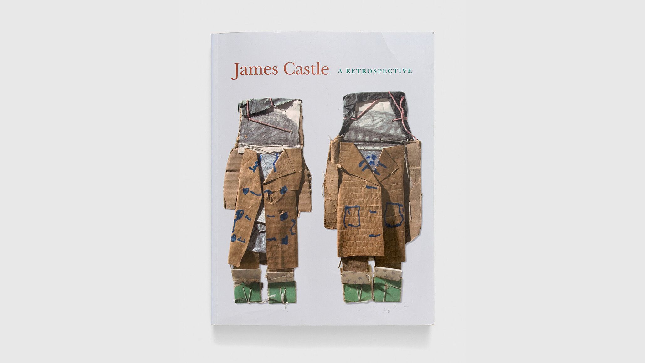 A photograph of a book titled James Castle: A Retrospective