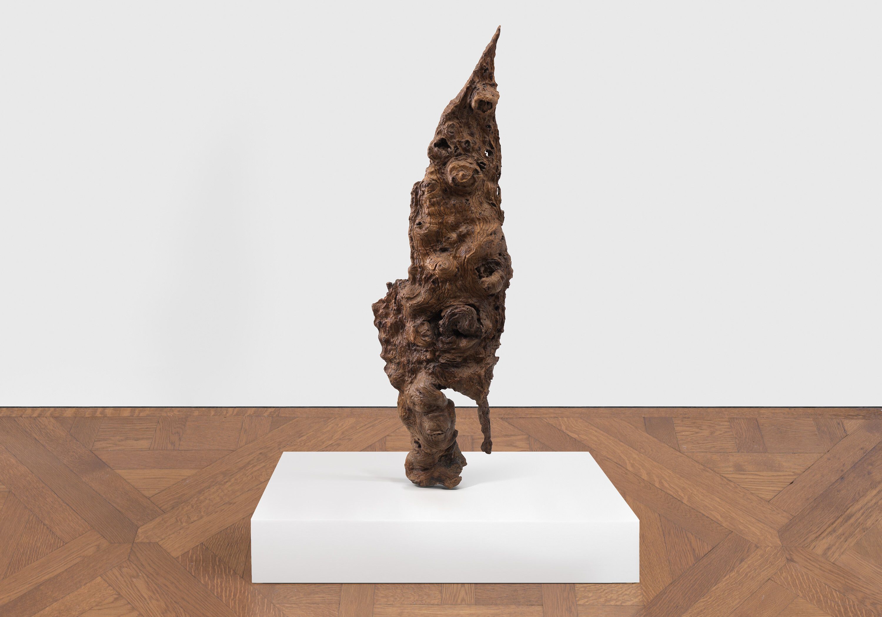 A burl wood sculpture by Sherrie Levine, titled Scholar Figure, dated 2023.