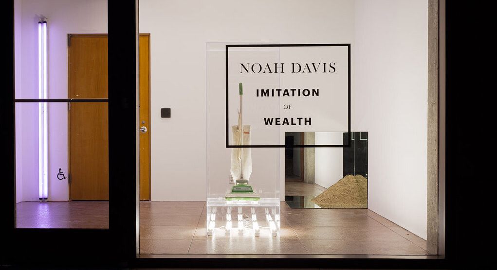 An installation view of an exhibition titled Imitation of Wealth Curated by Noah Daviss at The Underground Museum in 2013.