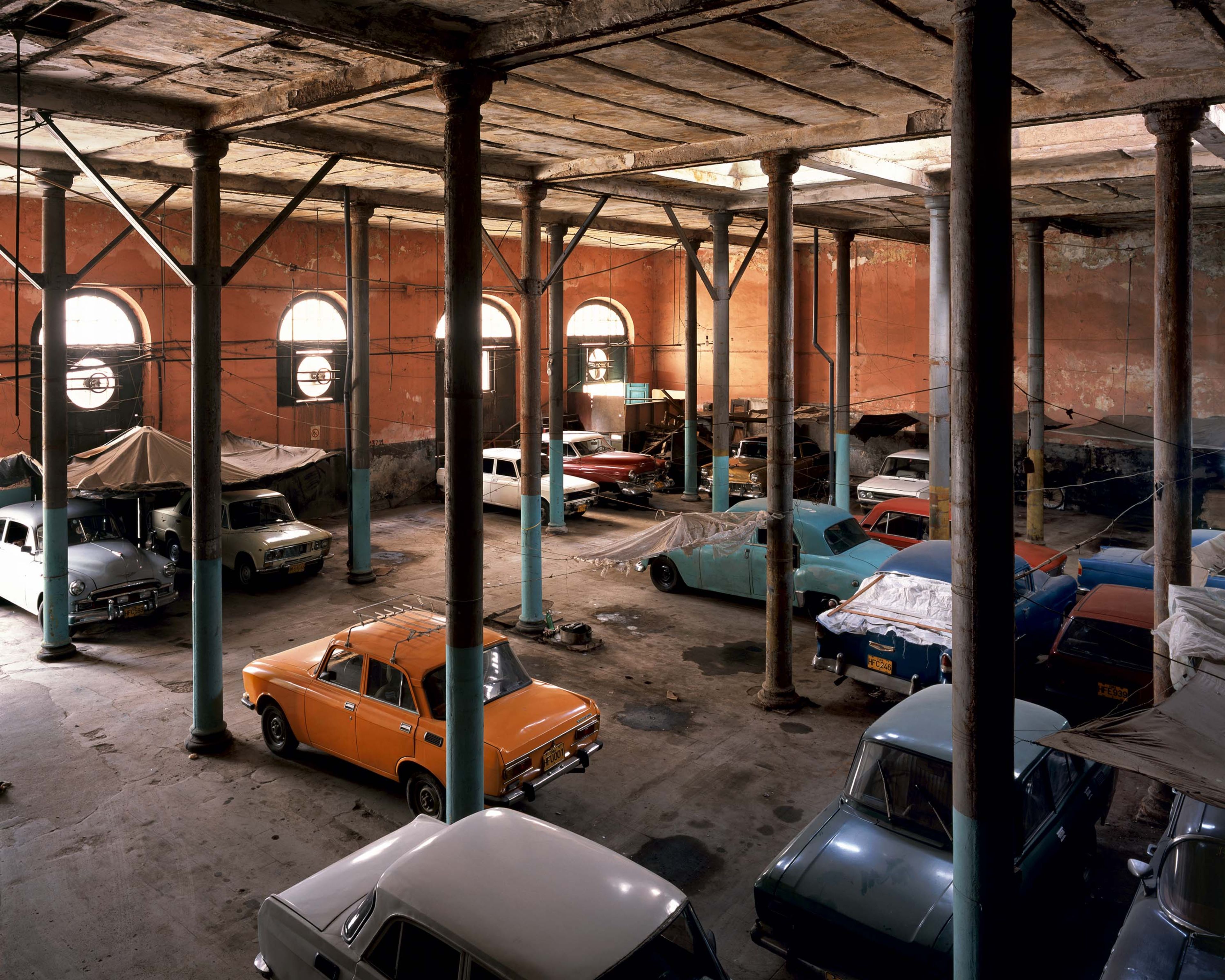 A photograph by Stan Douglas, titled Print Shop / Auto Shop, Habana Vieja, dated 2004.