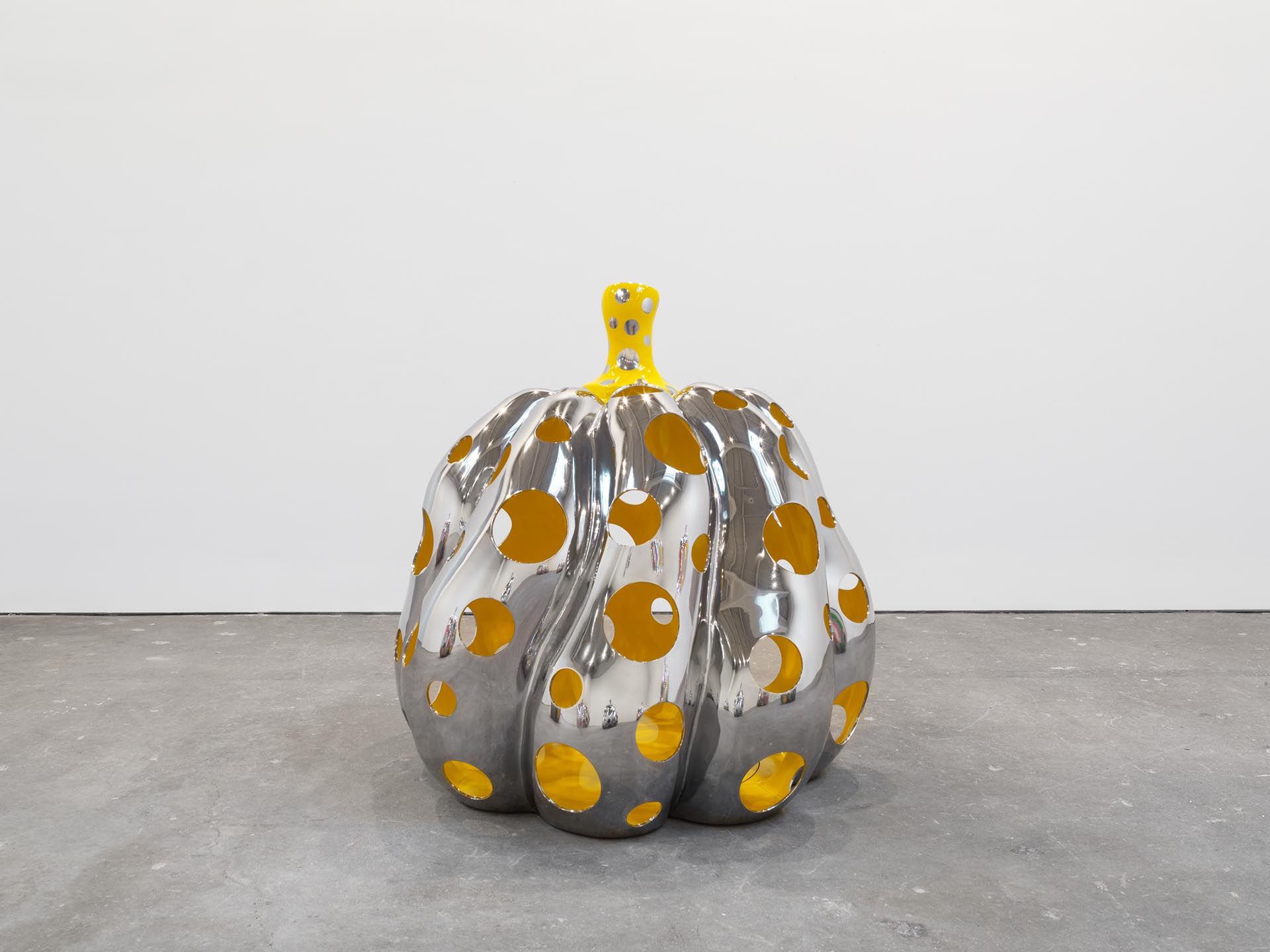 A sculpture by Yayoi Kusama, titled PUMPKIN, dated 2015.