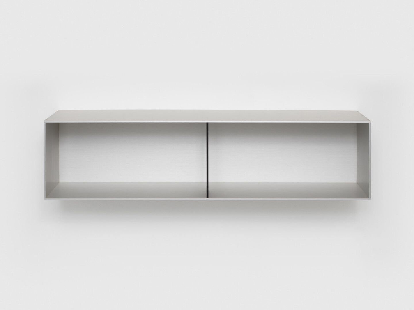 An untitled clear and black anodized aluminum sculpture by Donald Judd, dated 1991.