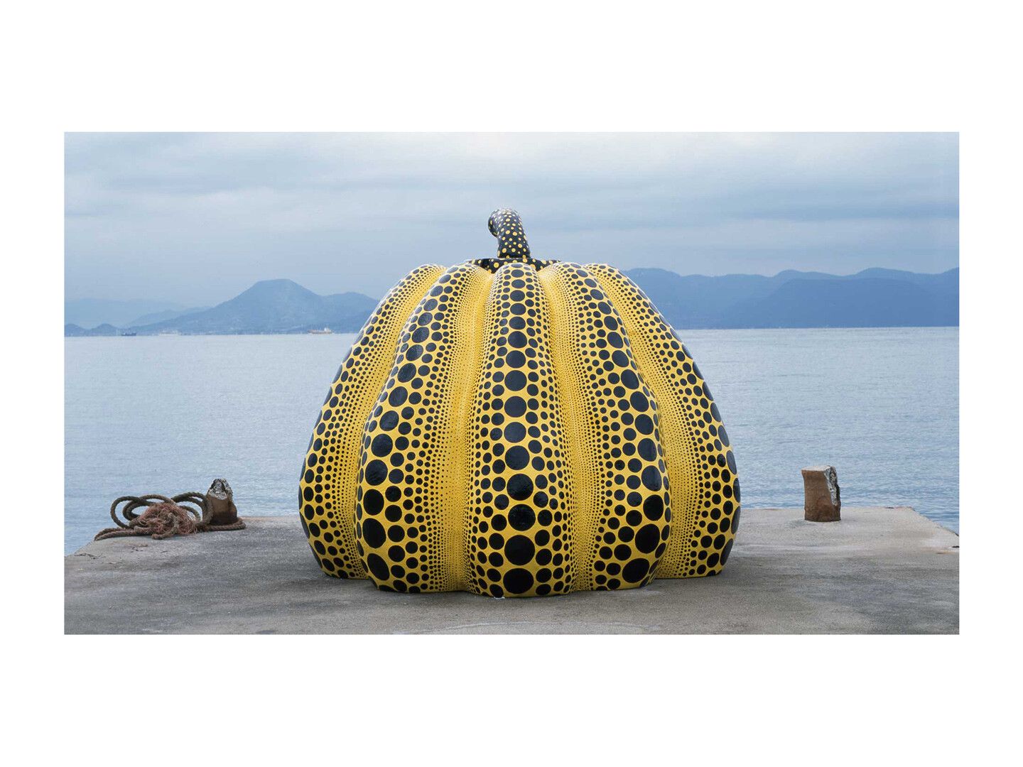 A sculpture by Yayoi Kusama, titled, Pumpkin (1994), installed in Naoshima, Japan