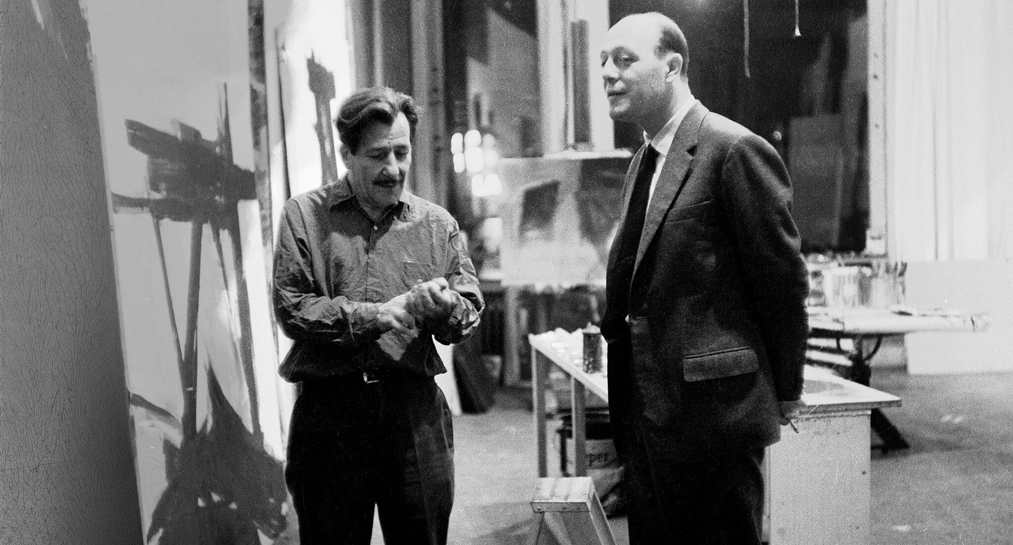 A photo of Piero Dorazio (right) visiting Franz Kline (left) in his West 14th Street studio, New York, 1960.