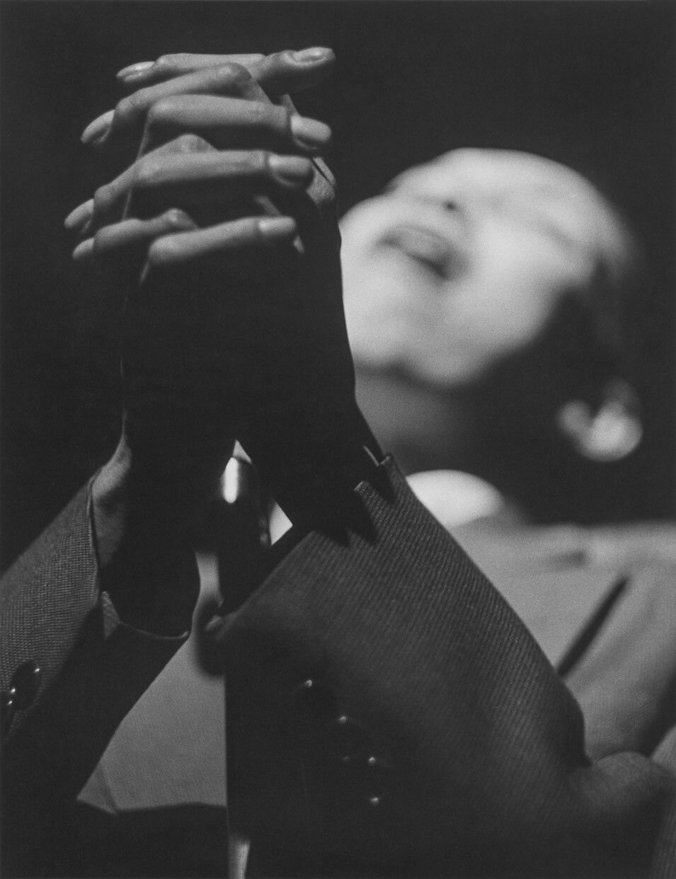 A silver gelatin print by Roy DeCarava, titled Jimmy Scott singing, dated 1956.