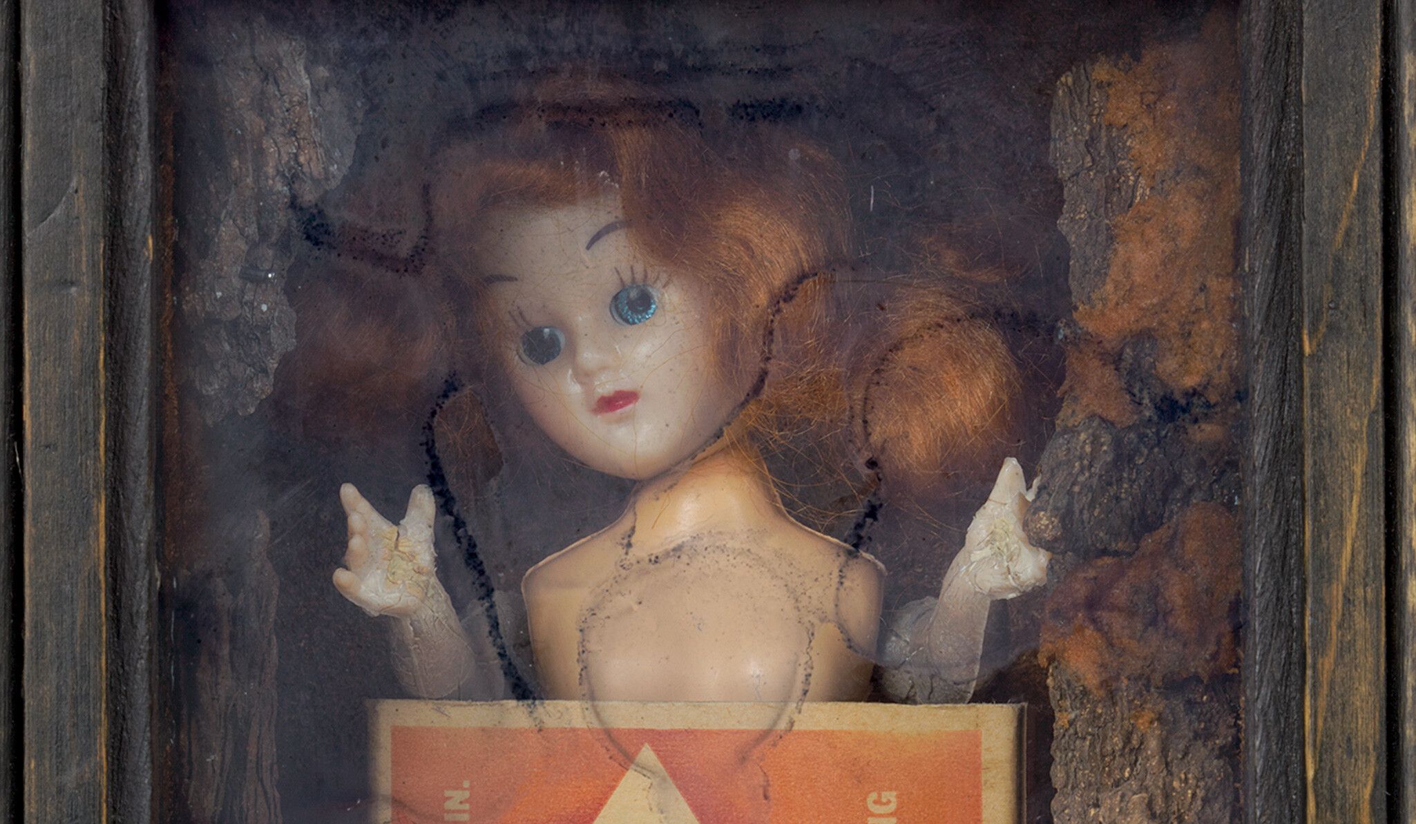 A detail from a Doll and Diamond match box in wooden box frame titled Untitled by Joseph Cornell, c. 1955