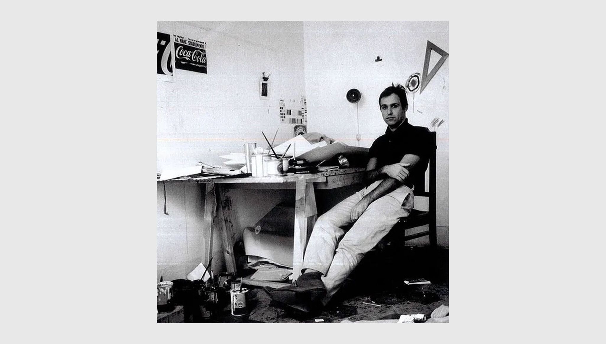 A photo of Mario Schifano in his studio
