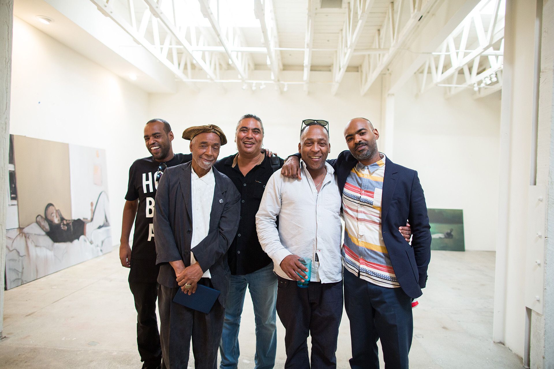 A photo of Noah Davis, David Hammons, Ian White, Henry Taylor, and Kahlil Joseph, Underground Museum in 2015.