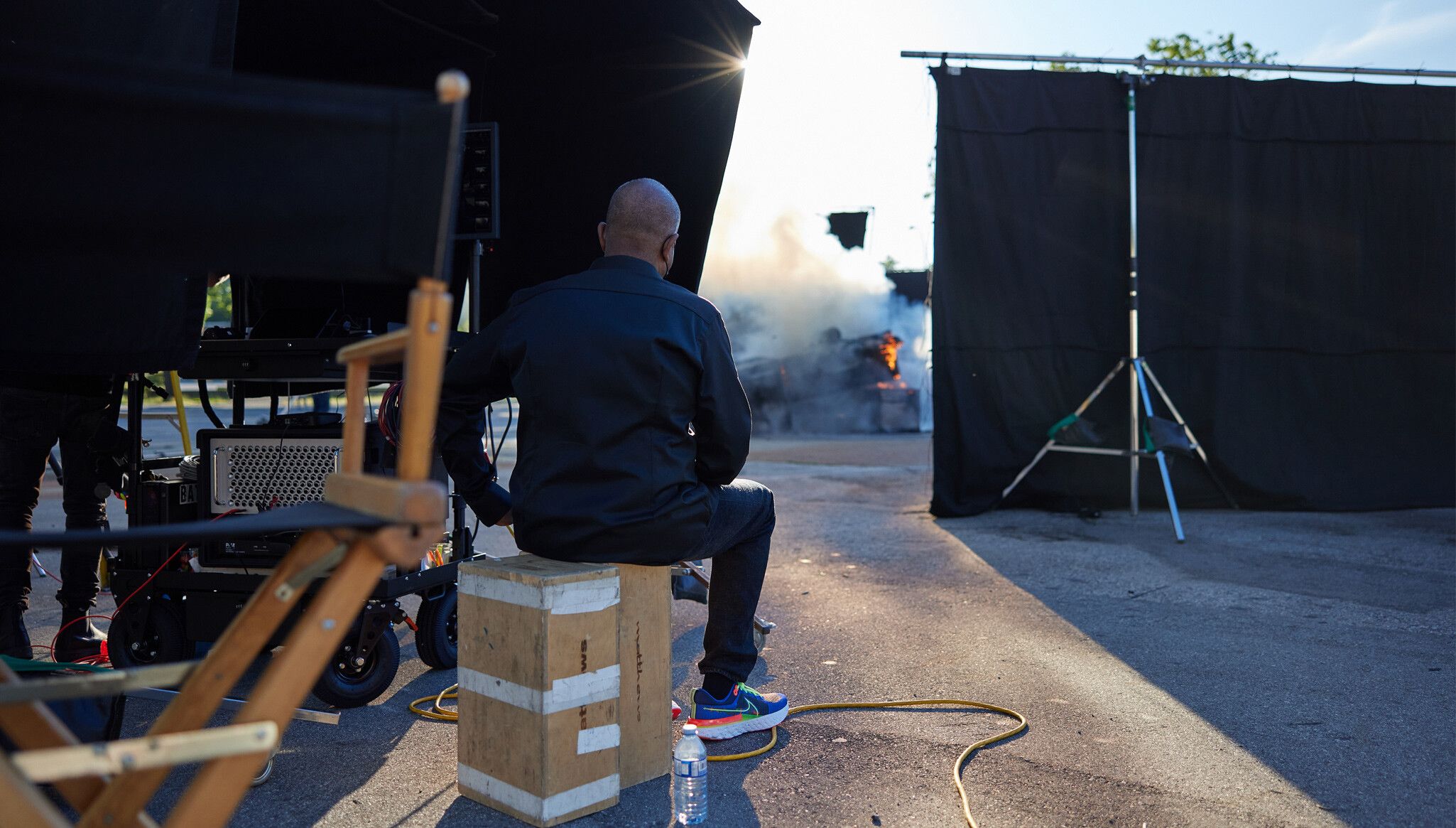 A  Photo by Evaan Kheraj of Stan Douglas on set in Vancouver, dated 2021.