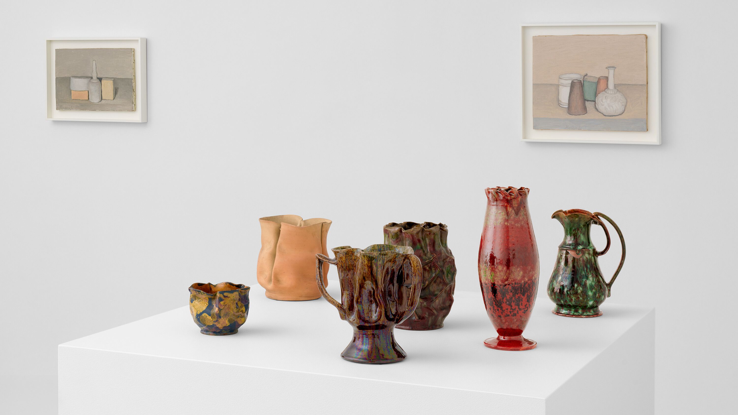 Install image of works by George Ohr and Giorgio Morandi for TEFAF 2024.