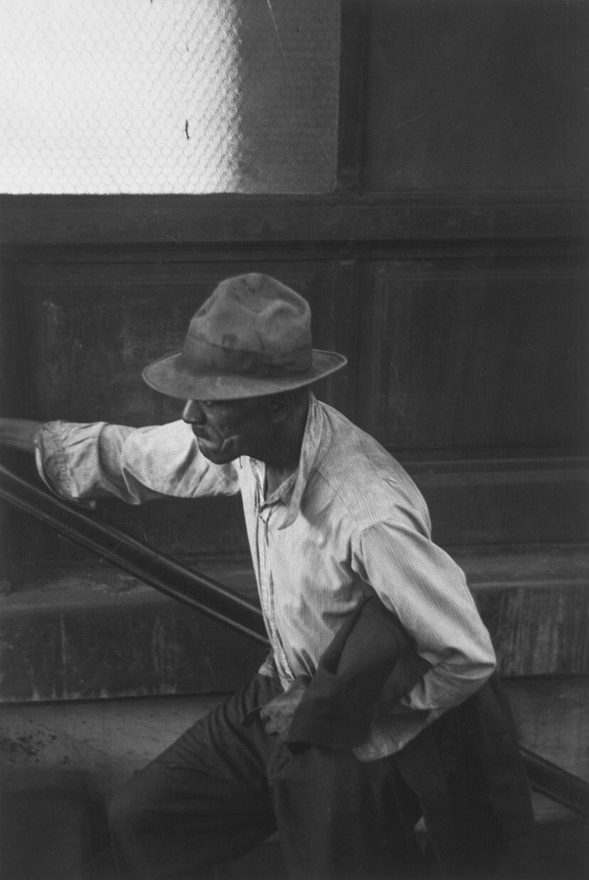 A silver gelatin print by Roy DeCarava, titled Man coming up subway stairs, dated 1952.