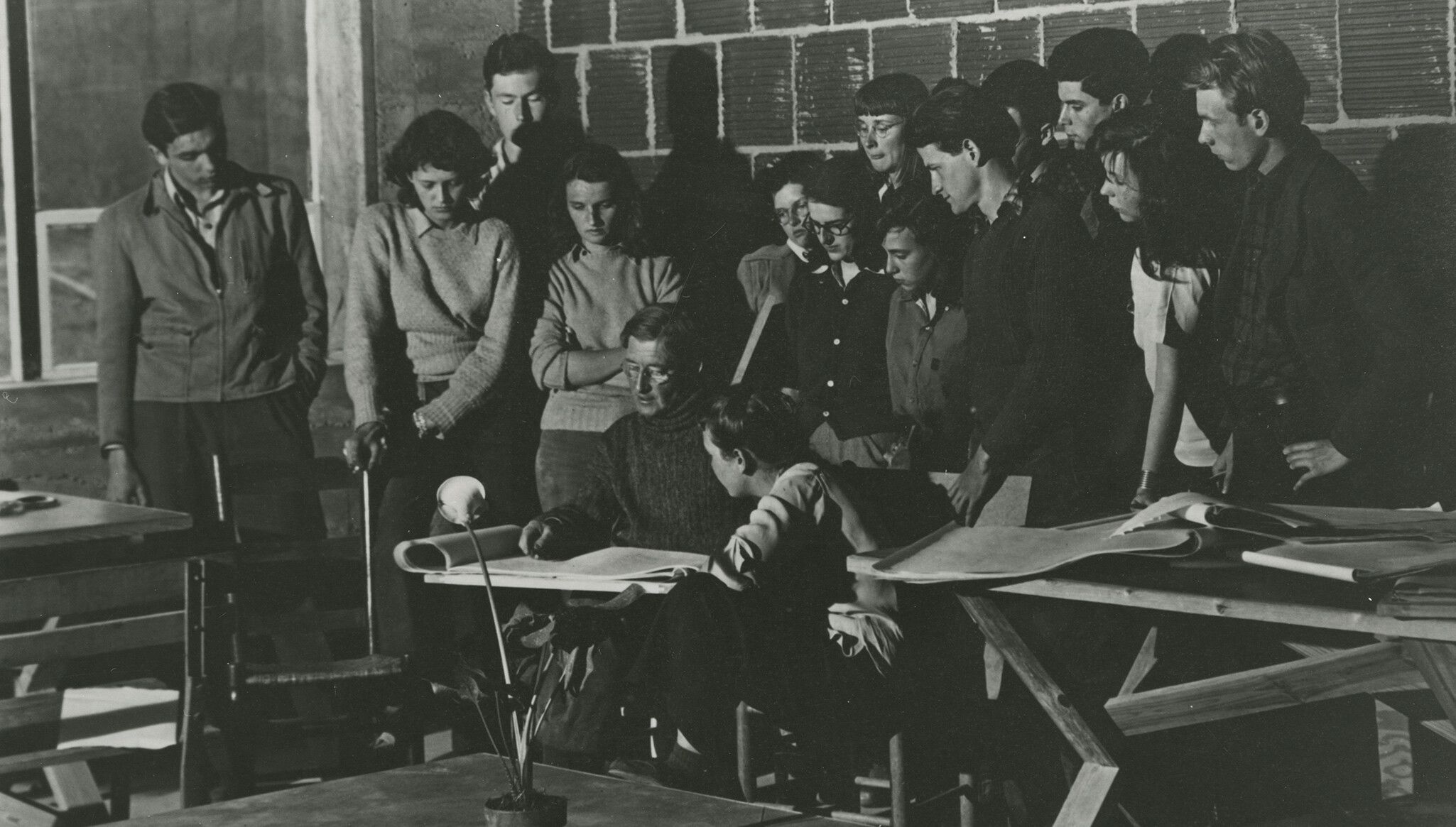 A photo of Josef Albers drawing a lily for his class, dated April 1942. 