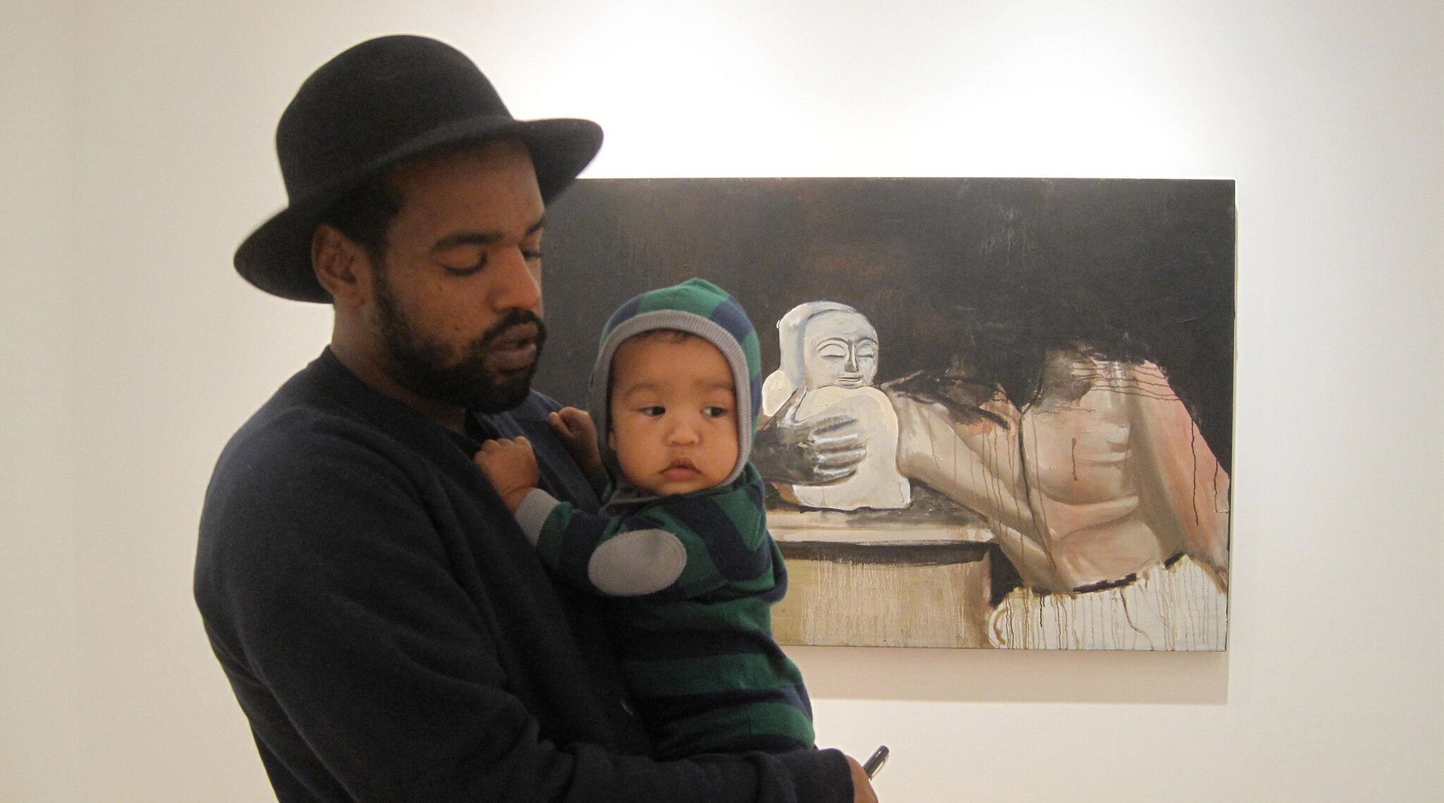 A photo of Noah Davis and his son Moses Davis at James Harris Gallery, Seattle, in 2010. Photo by Karon Davis.