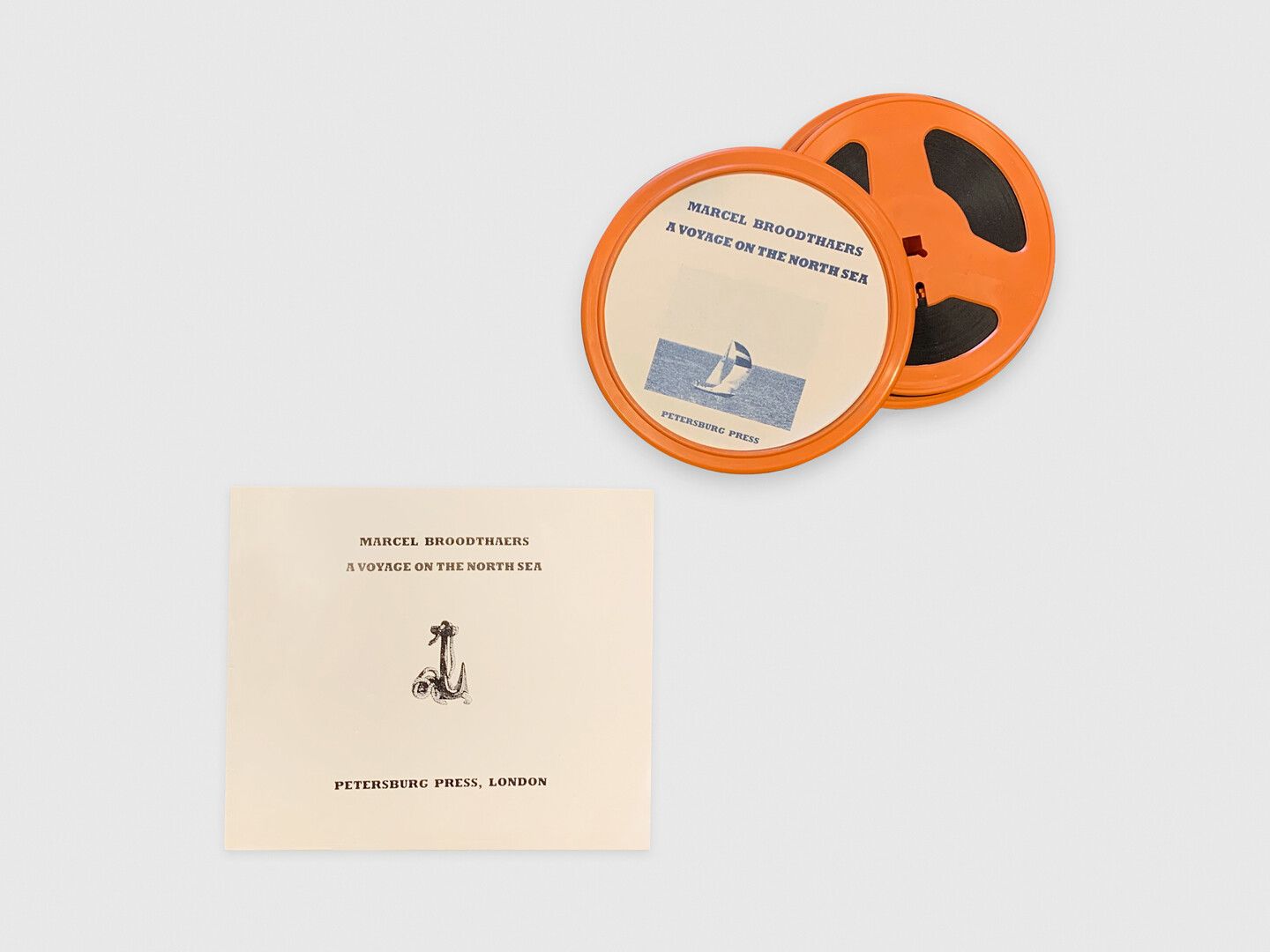16mm film rolls and a booklet corresponding to a video work by Marcel Broodthaers, titled, Un Voyage en Mer du Nord, dated 1974.