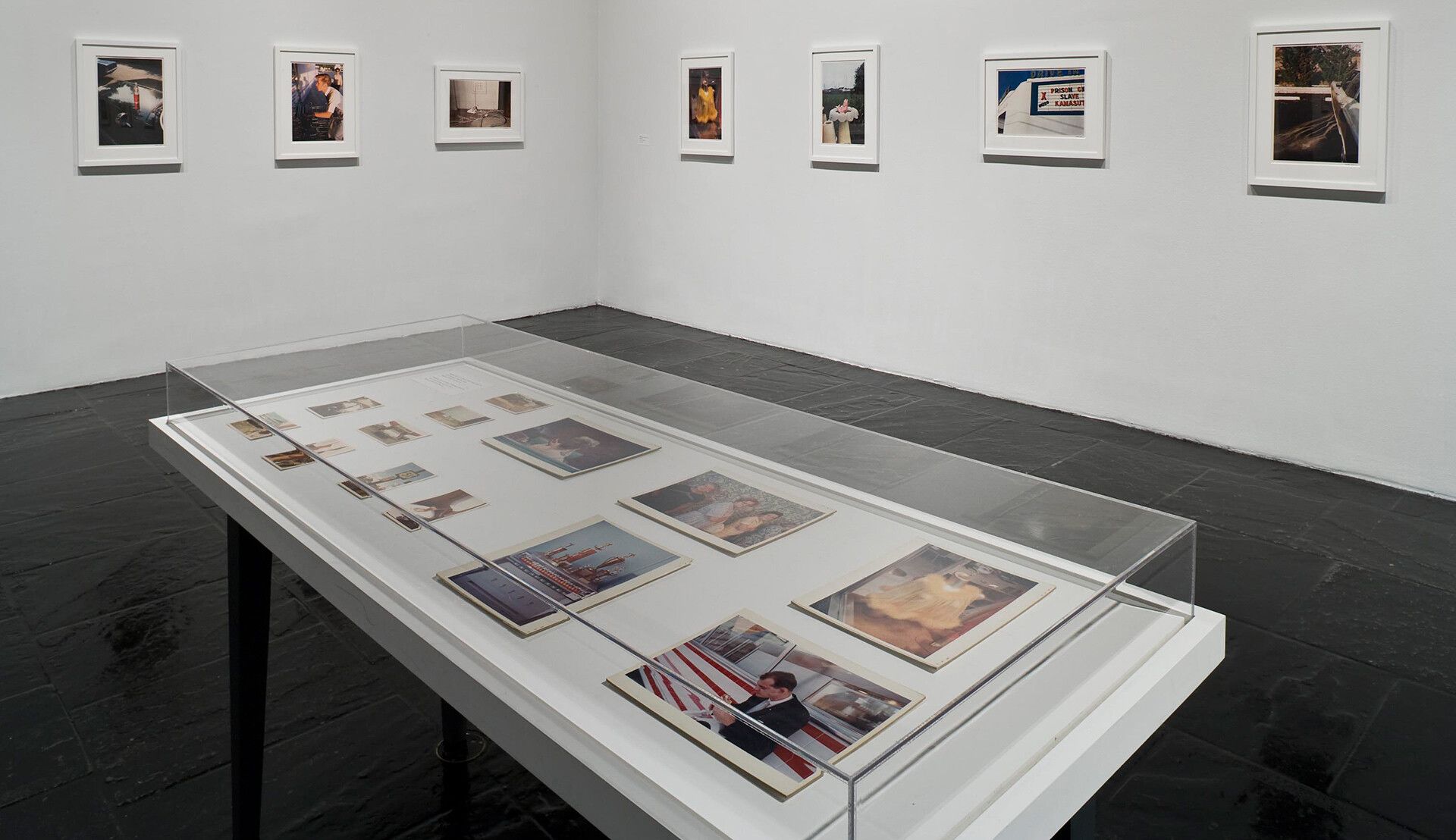 An installation view of the exhibition William Eggleston: Democratic Camera, Photographs and Video, 1961–2008 at the Whitney Museum of American Art, New York, in 2008.
