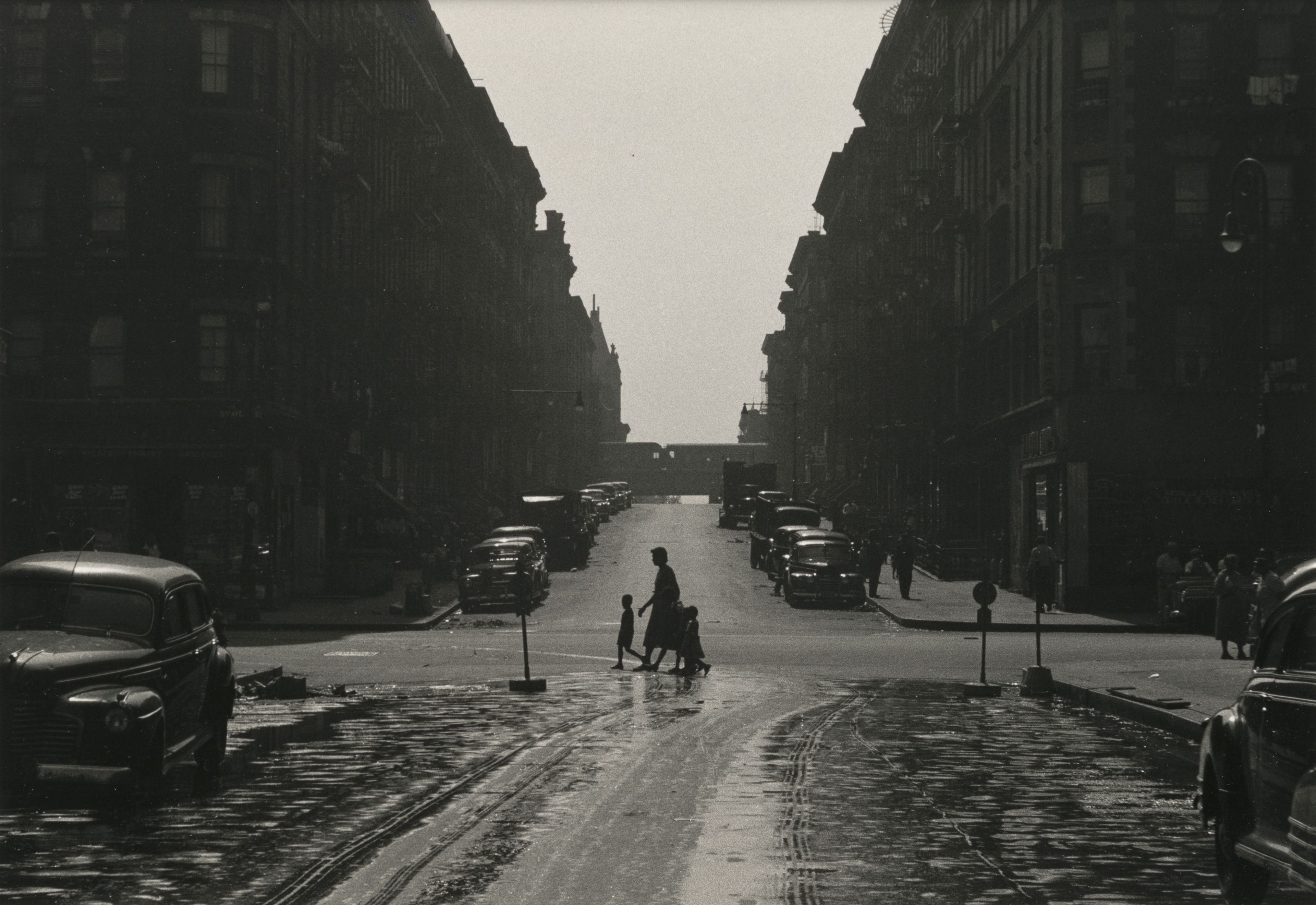 A photograph by Roy de Carava titled Woman and children at intersection, dated 1952.