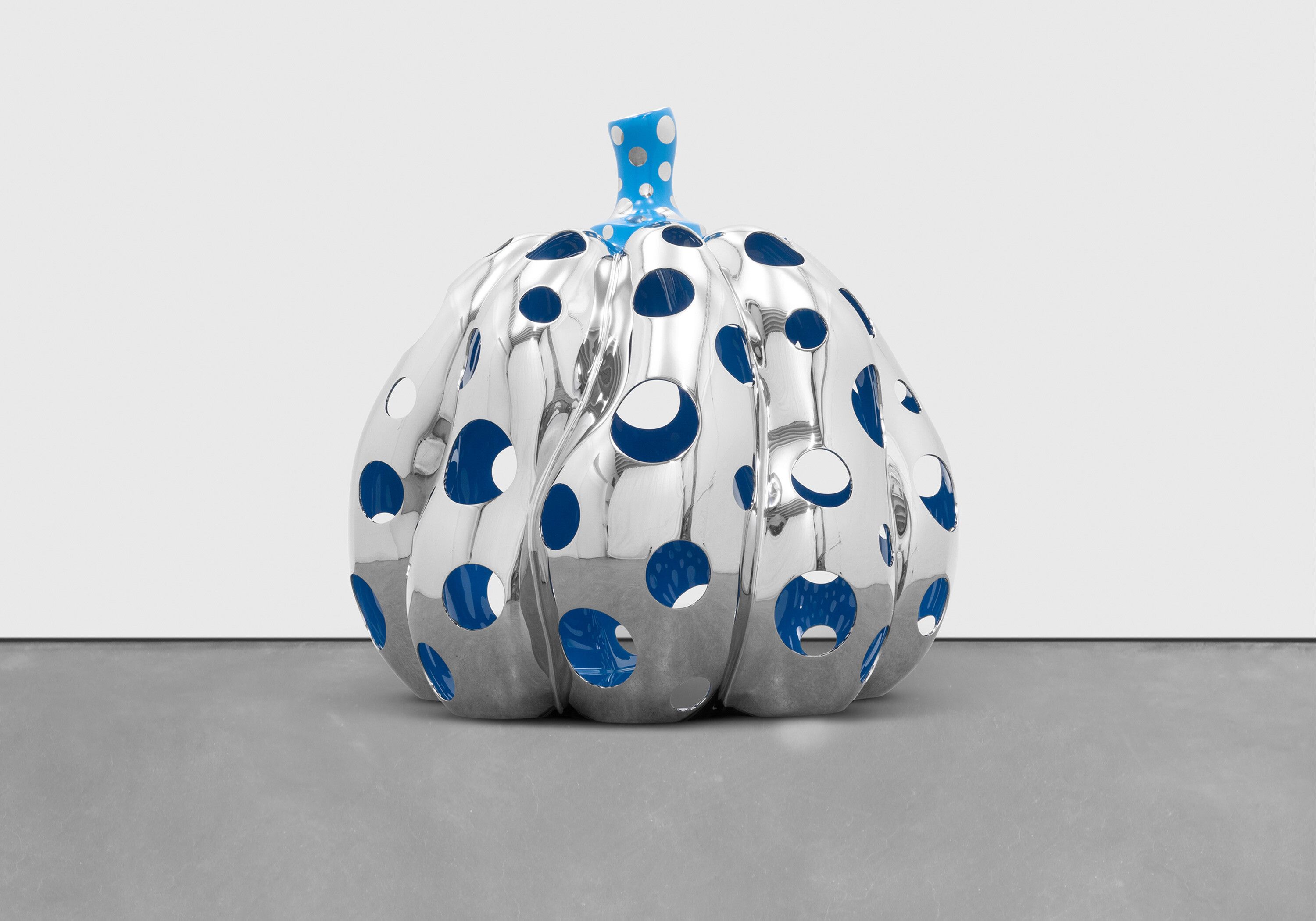 A sculpture by Yayoi Kusama, titled PUMPKIN (S), dated 2015.