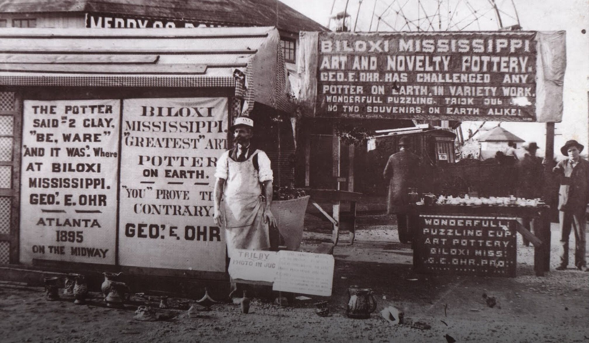 George Ohr presenting his pots at the International Exposition in Atlanta in 1895.
