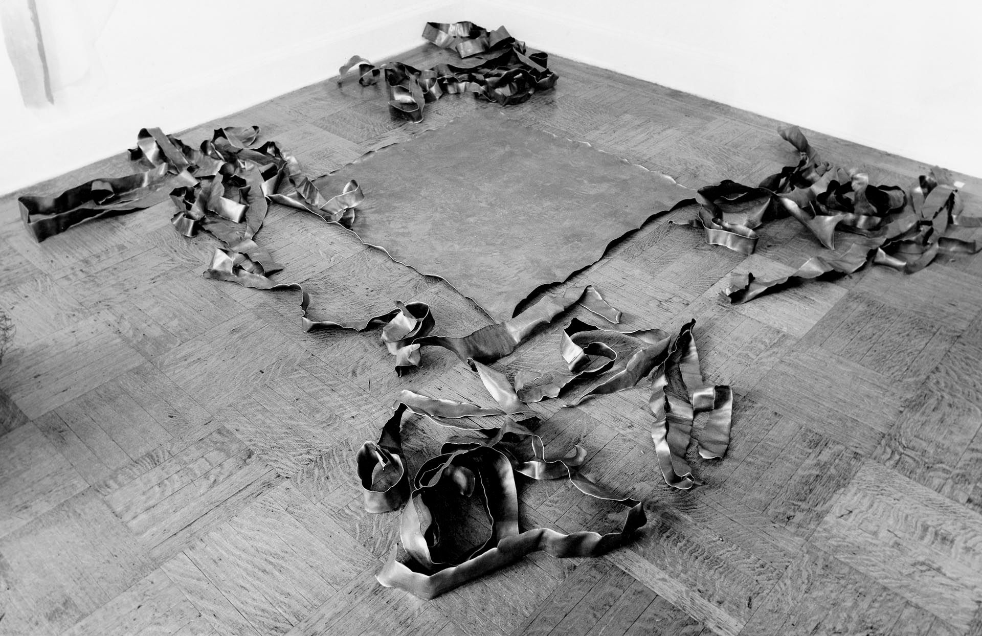 A lead sculpture by Richard Serra, titled Tearing Lead, dated 1968.