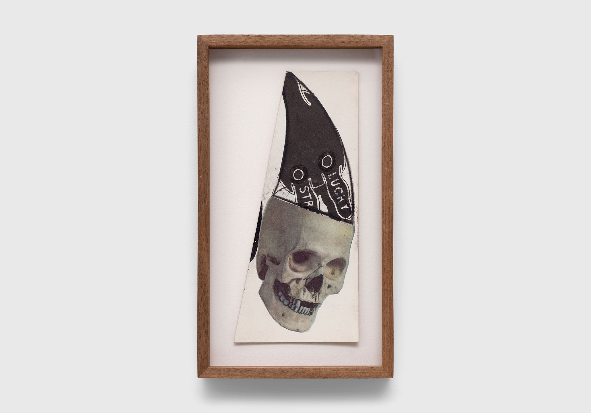A collage on illustration board by Ray Johnson, titled Untitled (Skull with Lucky Strike Bunny) , circa 1992.