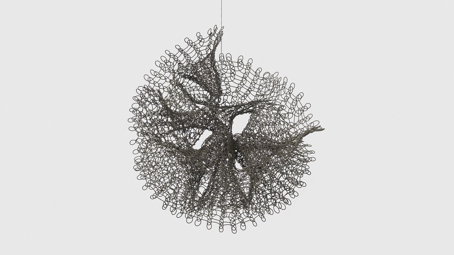 A hanging wire sculpture by Ruth Asawa, titled, Untitled (S.432, Hanging Interlocking Double Trumpets), circa 1958.