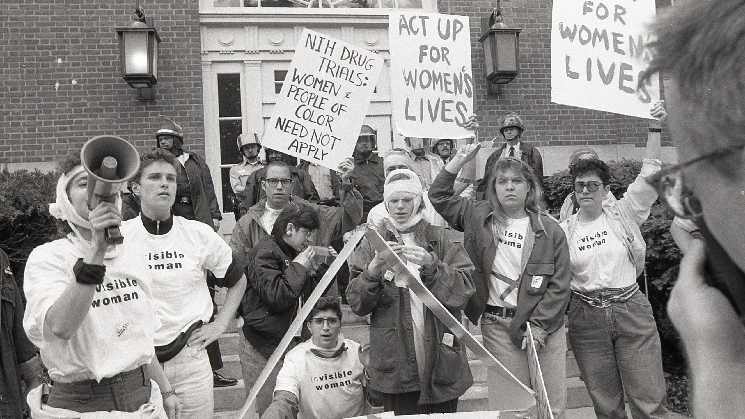 A photo of women demonstrating for ACT UP in 1990.