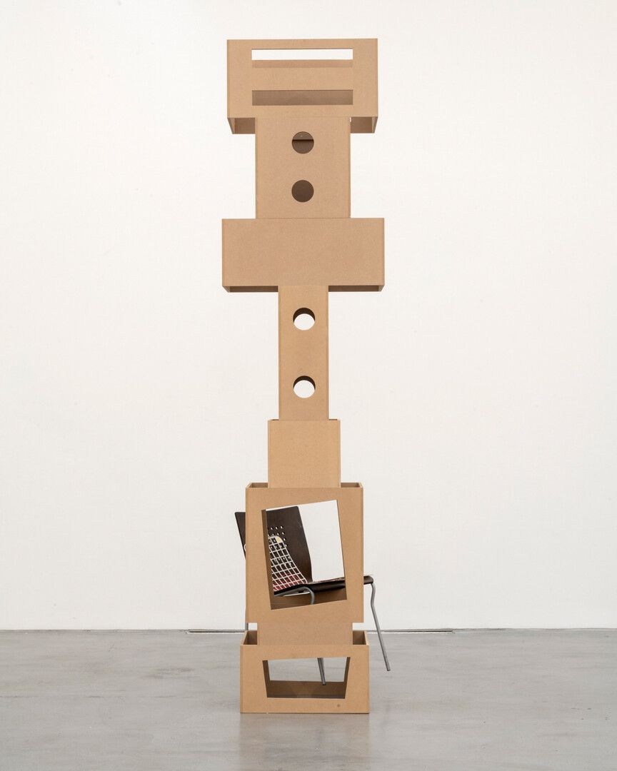 An untitled MDF tower, chair, mirror foil, silicon, model building parts, paint, and plastic grid sculpture by Isa Genzken, dated 2018.