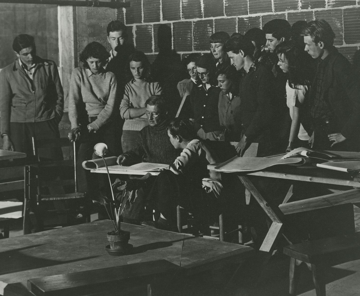 A photo of Josef Albers drawing a lily for his class, dated April 1942.