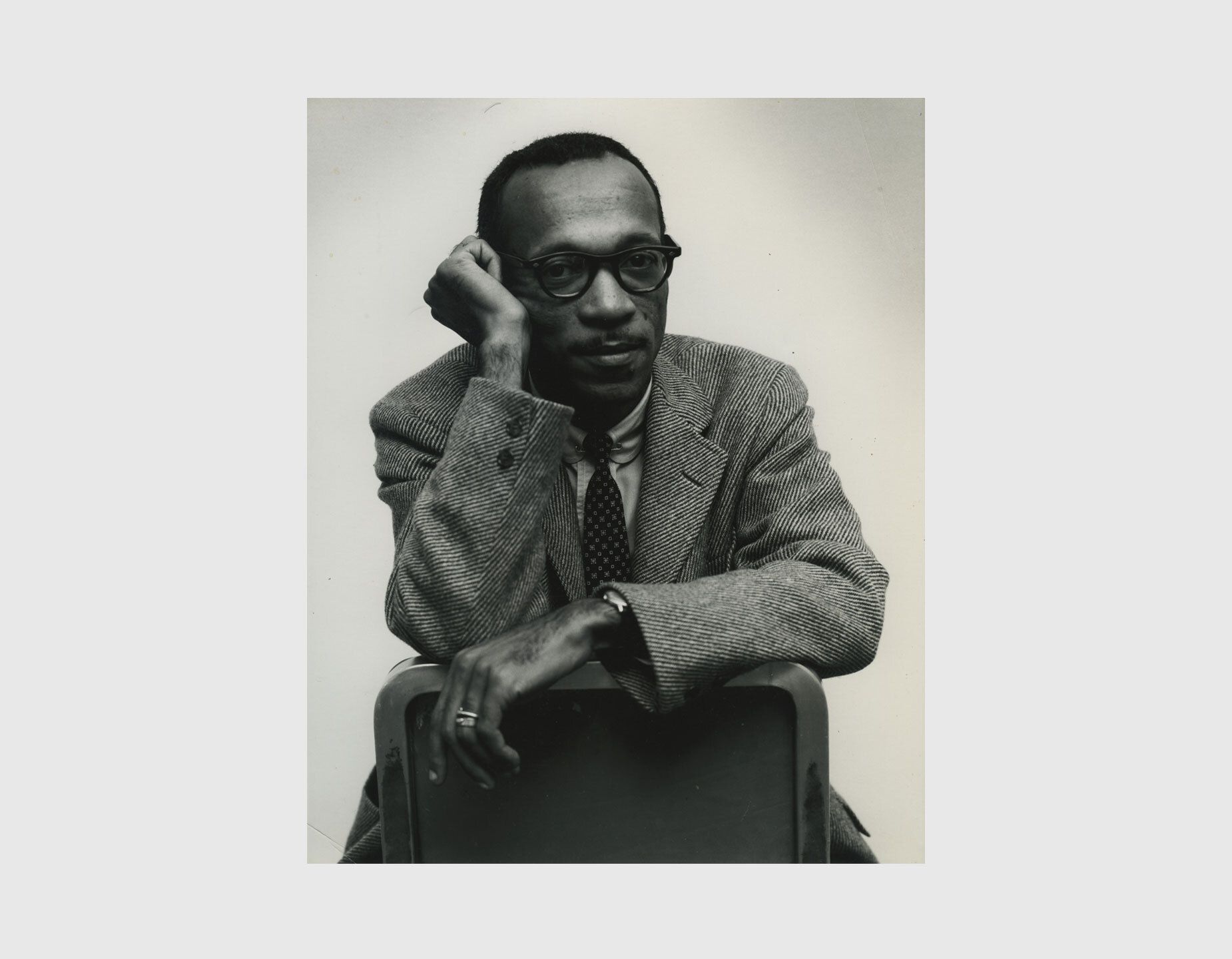 Portrait of Charles White sitting on a Chair and staring into the camera