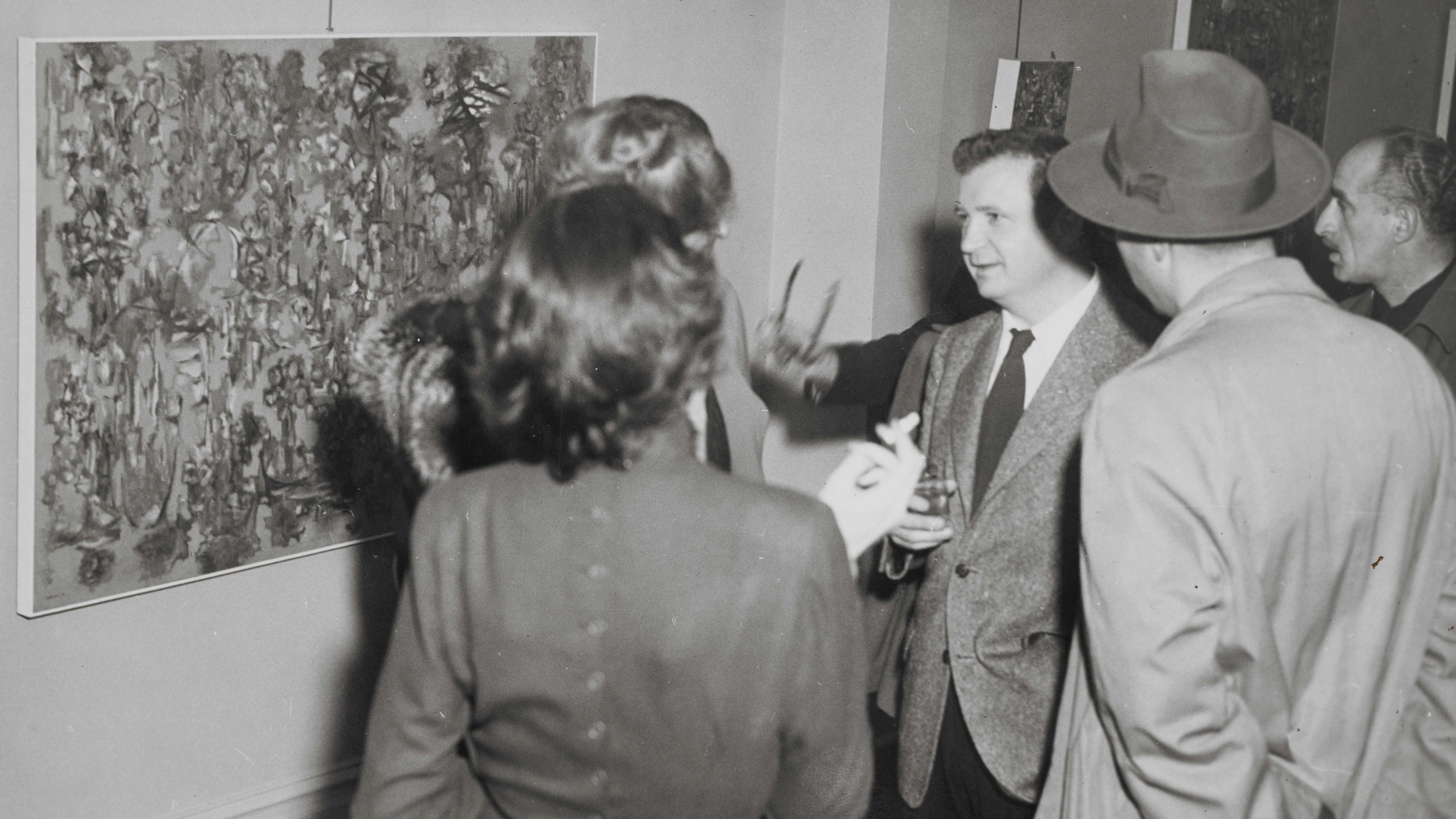 Ad Reinhardt at an opening of a solo exhibition in 1948