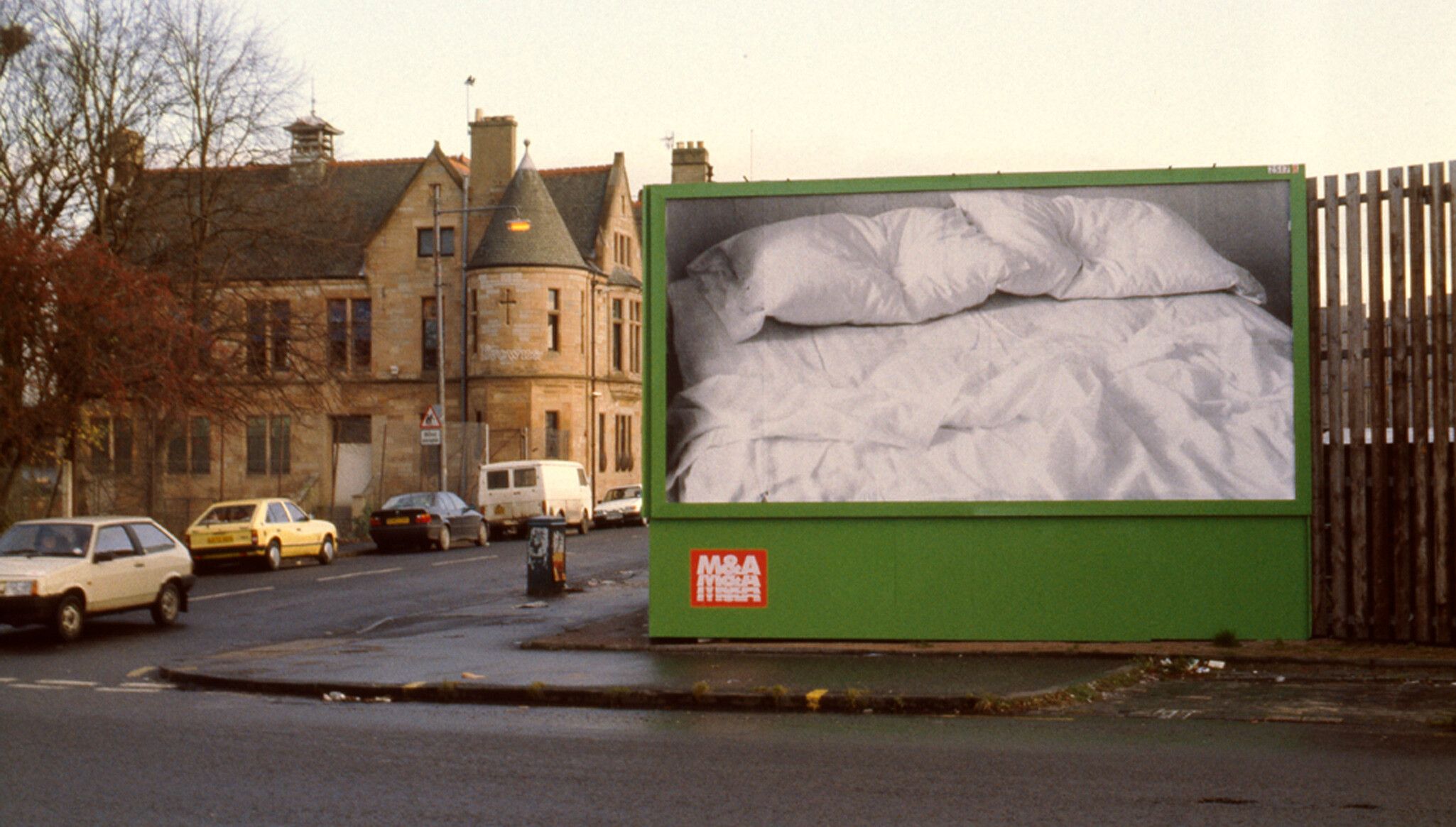 An installation view of an Untitled work, dated 1991, in Pollokshaws Road and Coplaw Street, Glasgow, as part of the exhibition Read My Lips: New York AIDS Polemics in Tramway of Glasgow, dated 1992