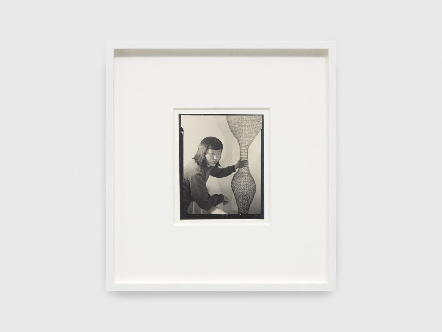 A gelatin silver print by Imogen Cunningham, titled Ruth Asawa and Her Wire Sculpture 2, dated 1951.