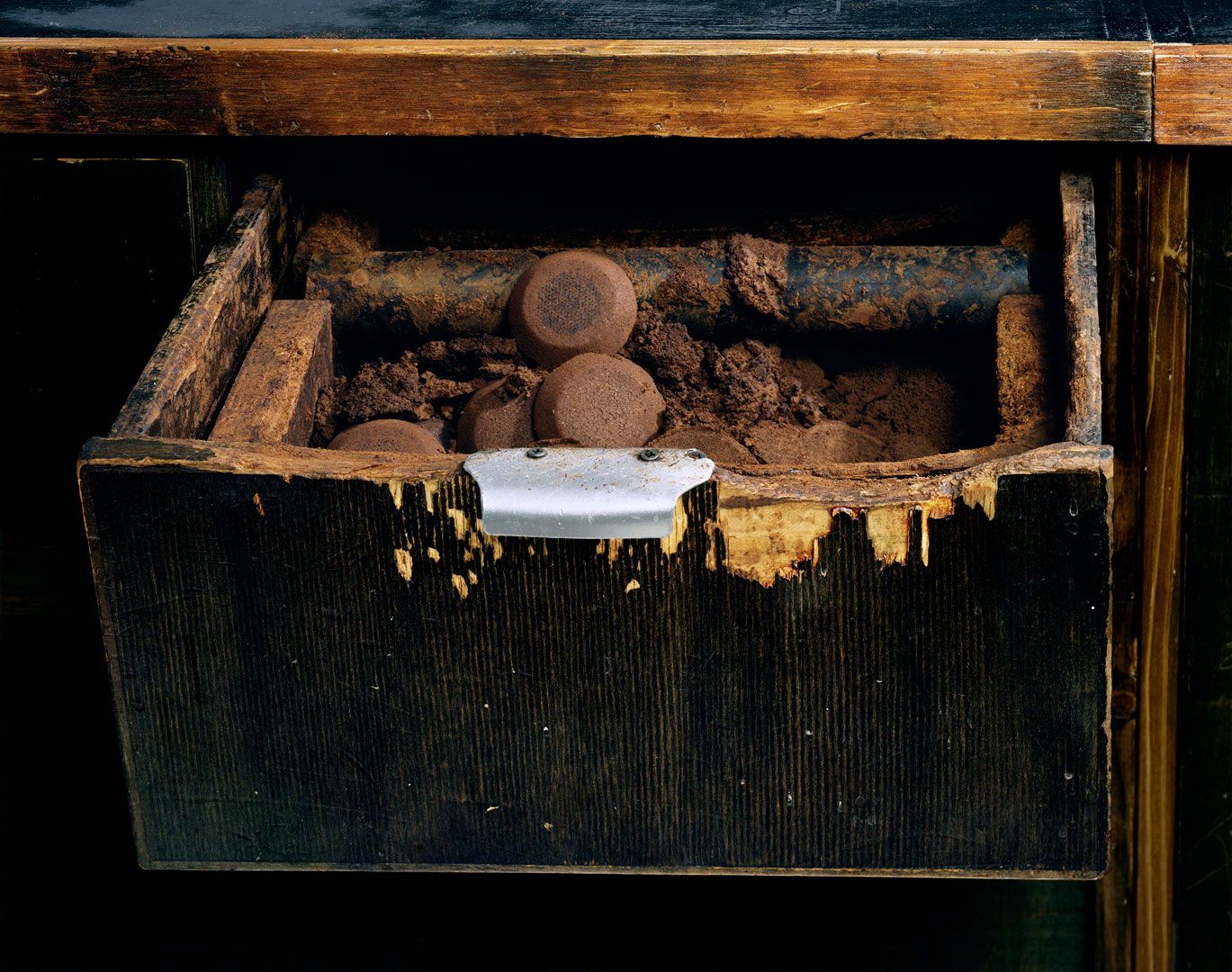 A photograph by Chris Williams titled Knockbox, 14 gram spent puck accumulator,  Kaffee + Kuchen  Venloer Str. 19. 50672 Köln, Germany  Studio Thomas Borho  Oberkasseler Str. 39, Düsseldorf, Germany  October 13, 2019, 2020, dated 2020.
