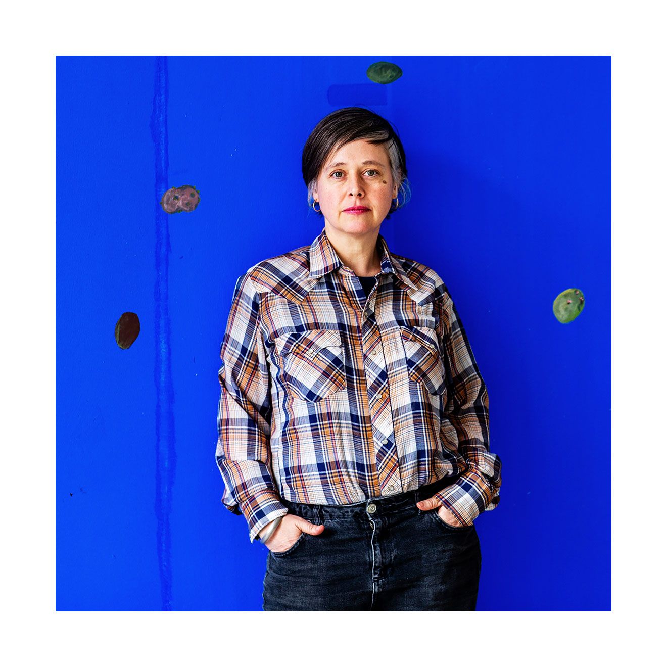 A portrait of Andrea Buttner.