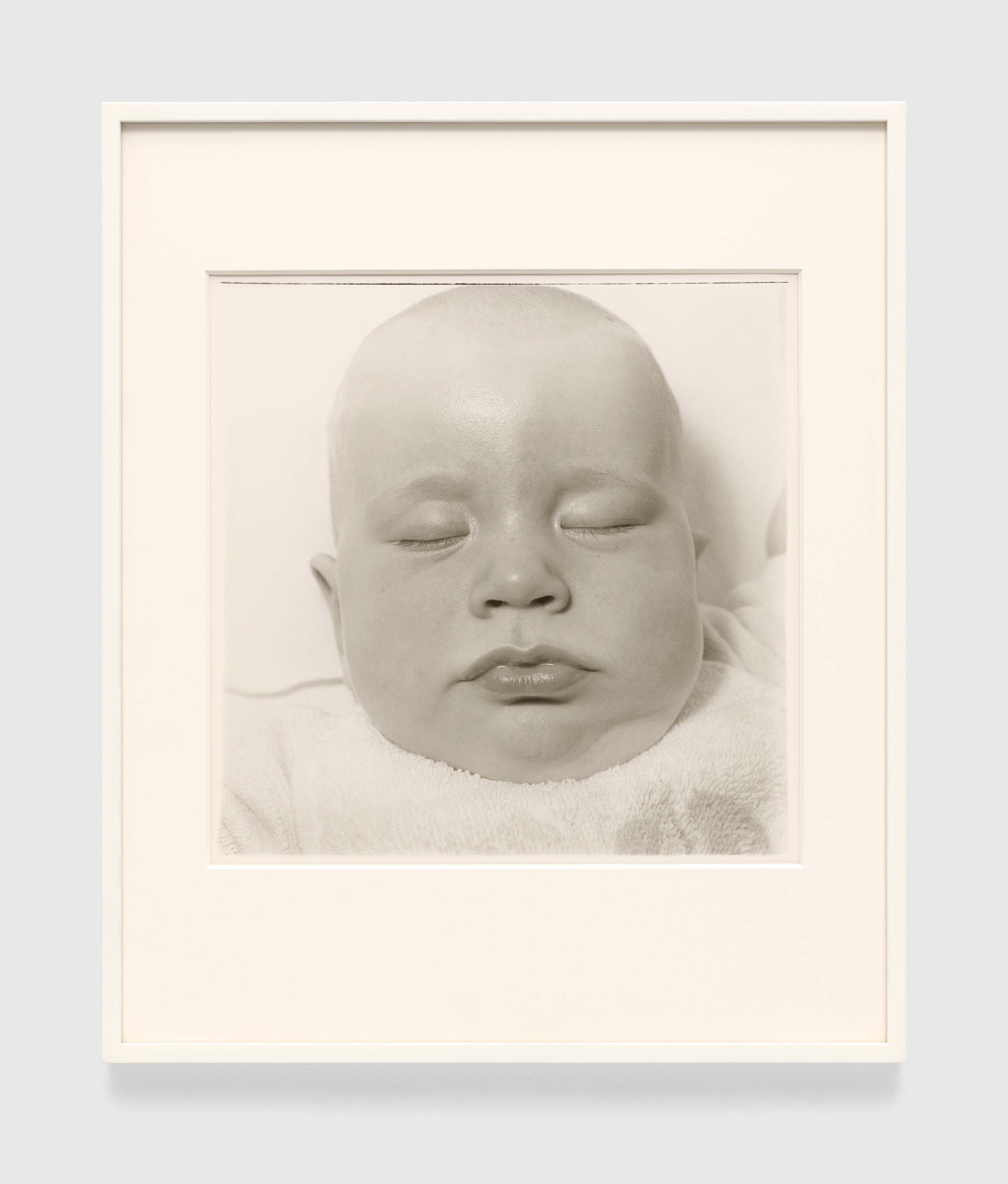 A gelatin silver print by Diane Arbus, titled A very young baby, N.Y.C. [Anderson Hays Cooper] 1968, dated 1968.