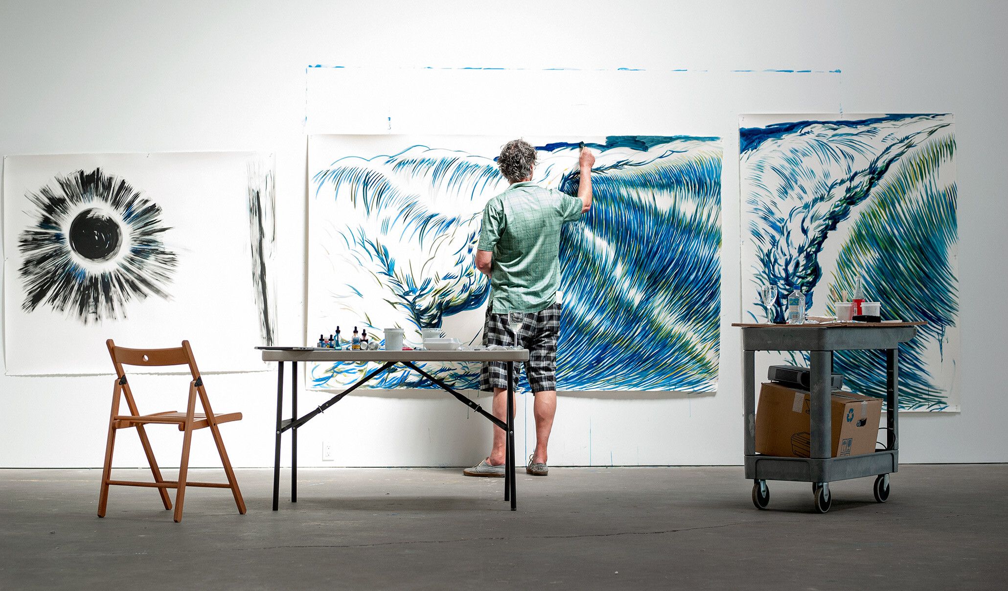A photo of Raymond Pettibon painting at David Zwirner, New York, circa 2011.